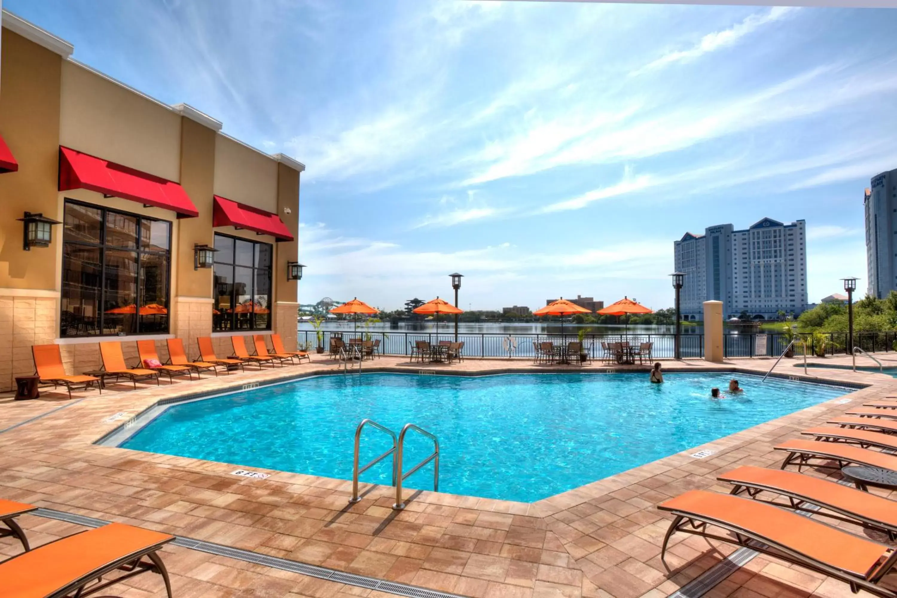 Lake view, Swimming Pool in Ramada Plaza by Wyndham Orlando Resort & Suites Intl Drive