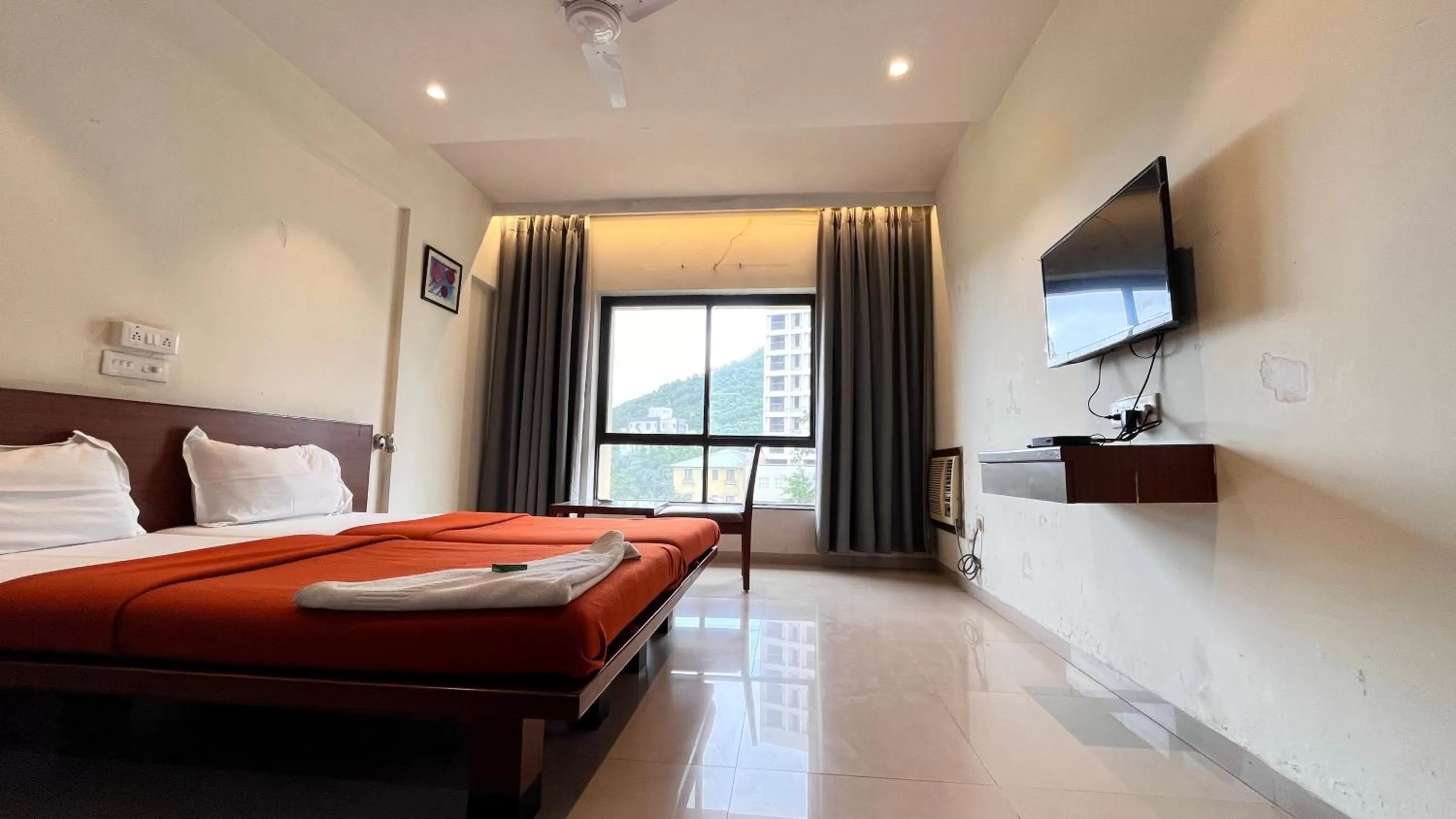 Communal lounge/ TV room, Bed in Hotel Sumanchandra Suites