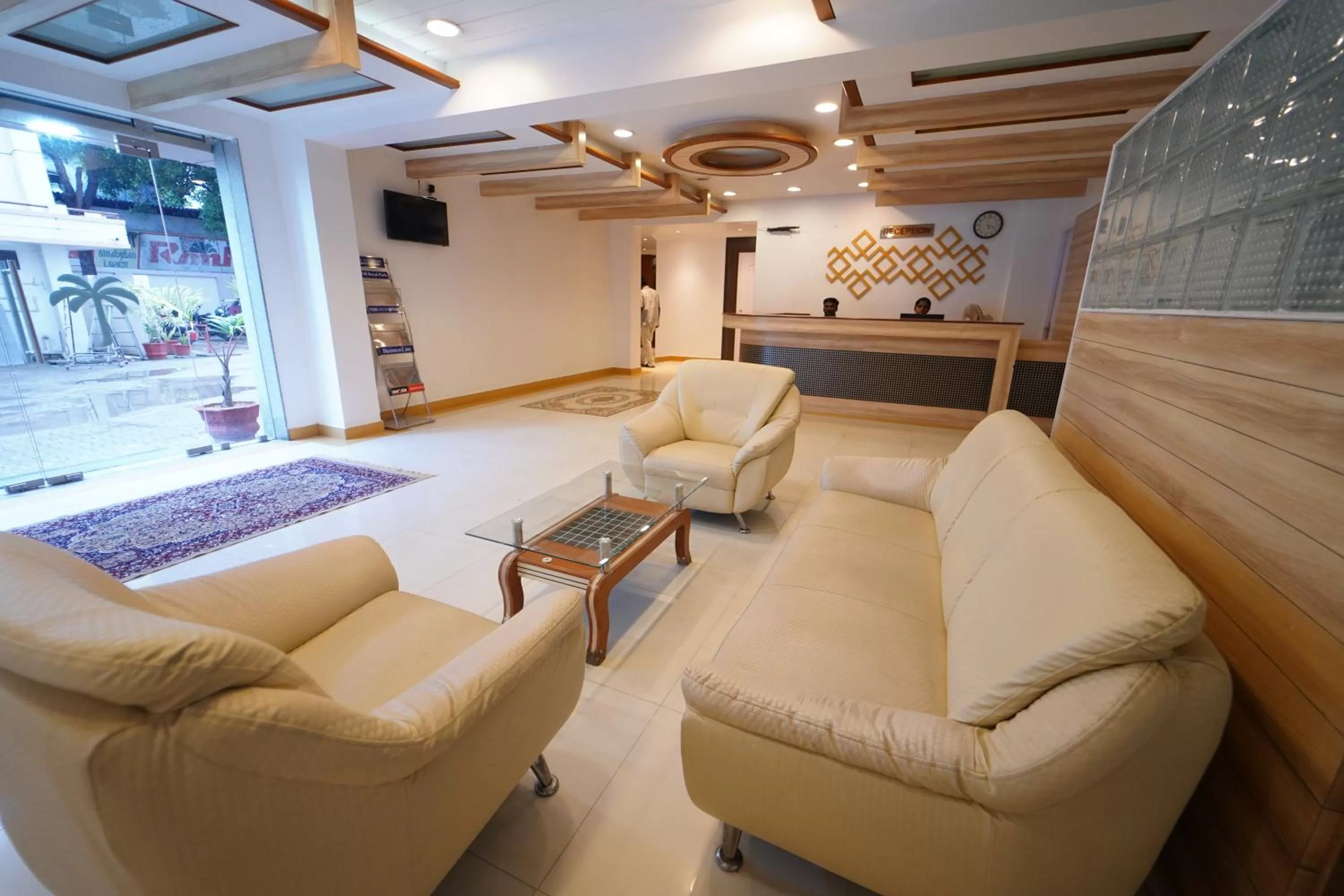 Lobby or reception in Hotel Palmyra Grand Inn