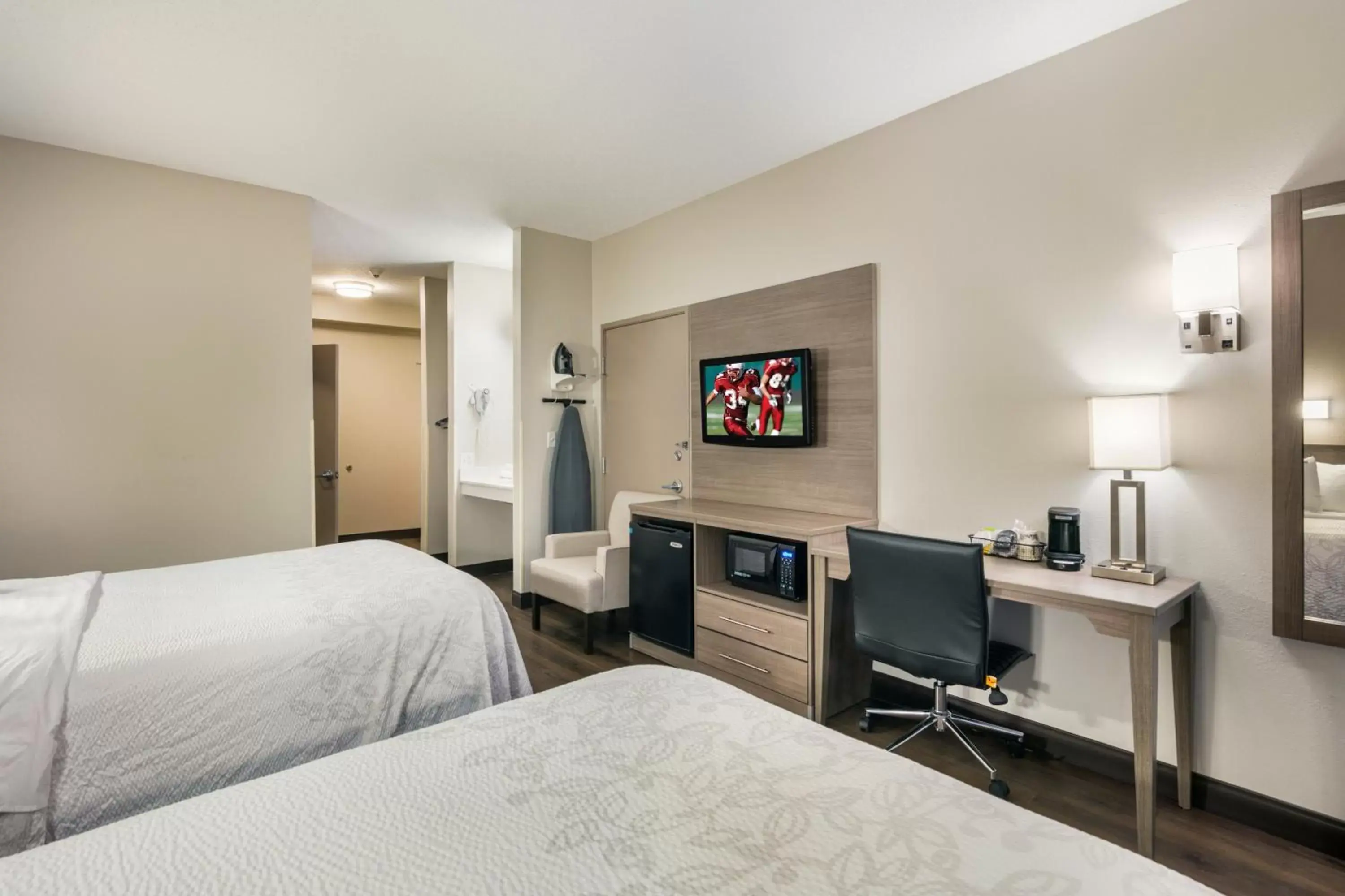 Photo of the whole room, TV/Entertainment Center in Red Roof Inn PLUS+ Boston - Logan