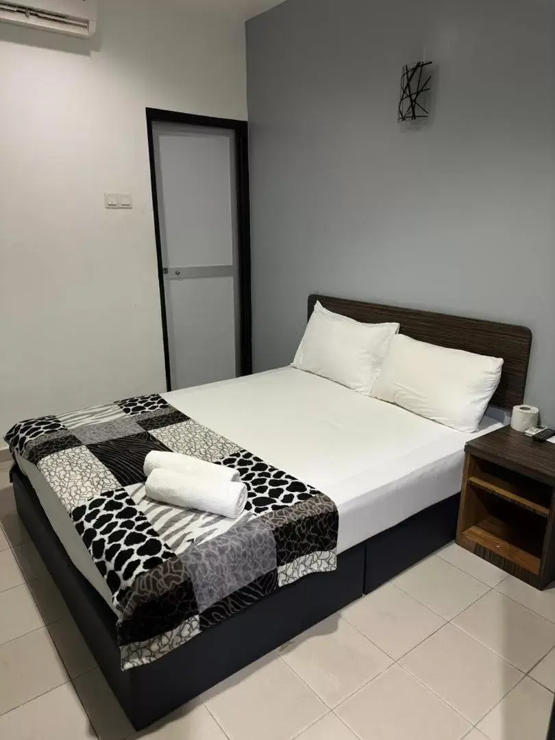 Bed in ISLAND TIME MOTEL KUAH