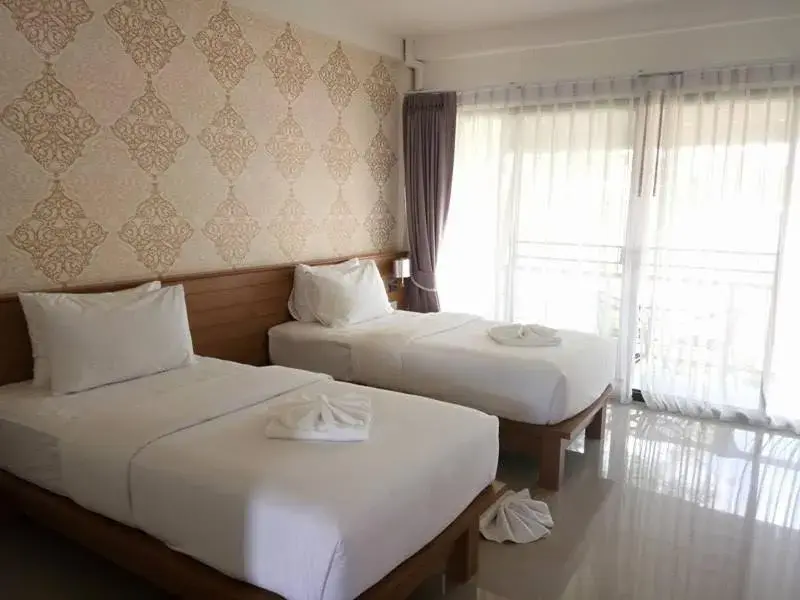 Property building, Bed in Palmari Boutique Hotel
