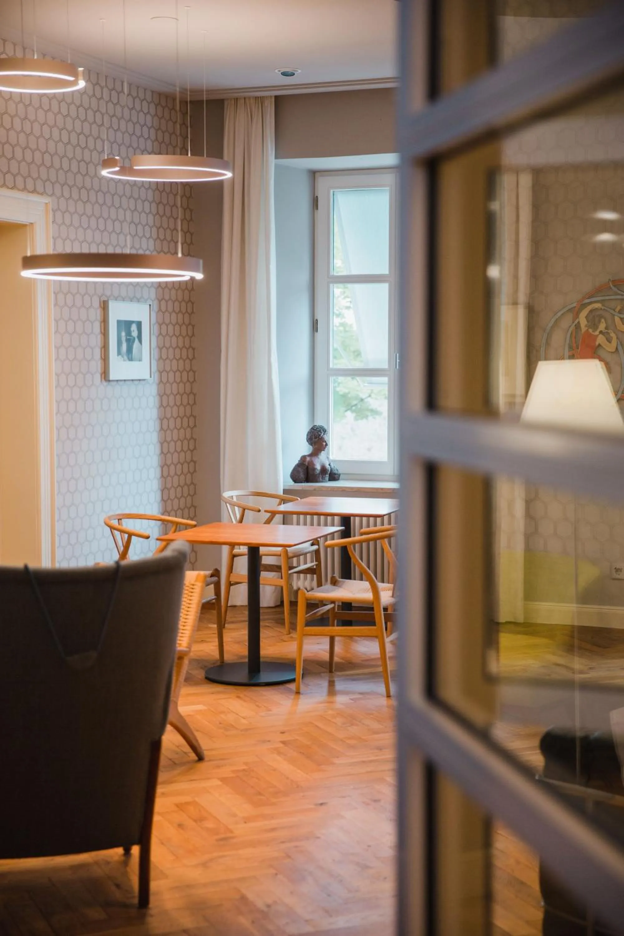 Communal lounge/ TV room in MOMA1890 Boutique Hotel