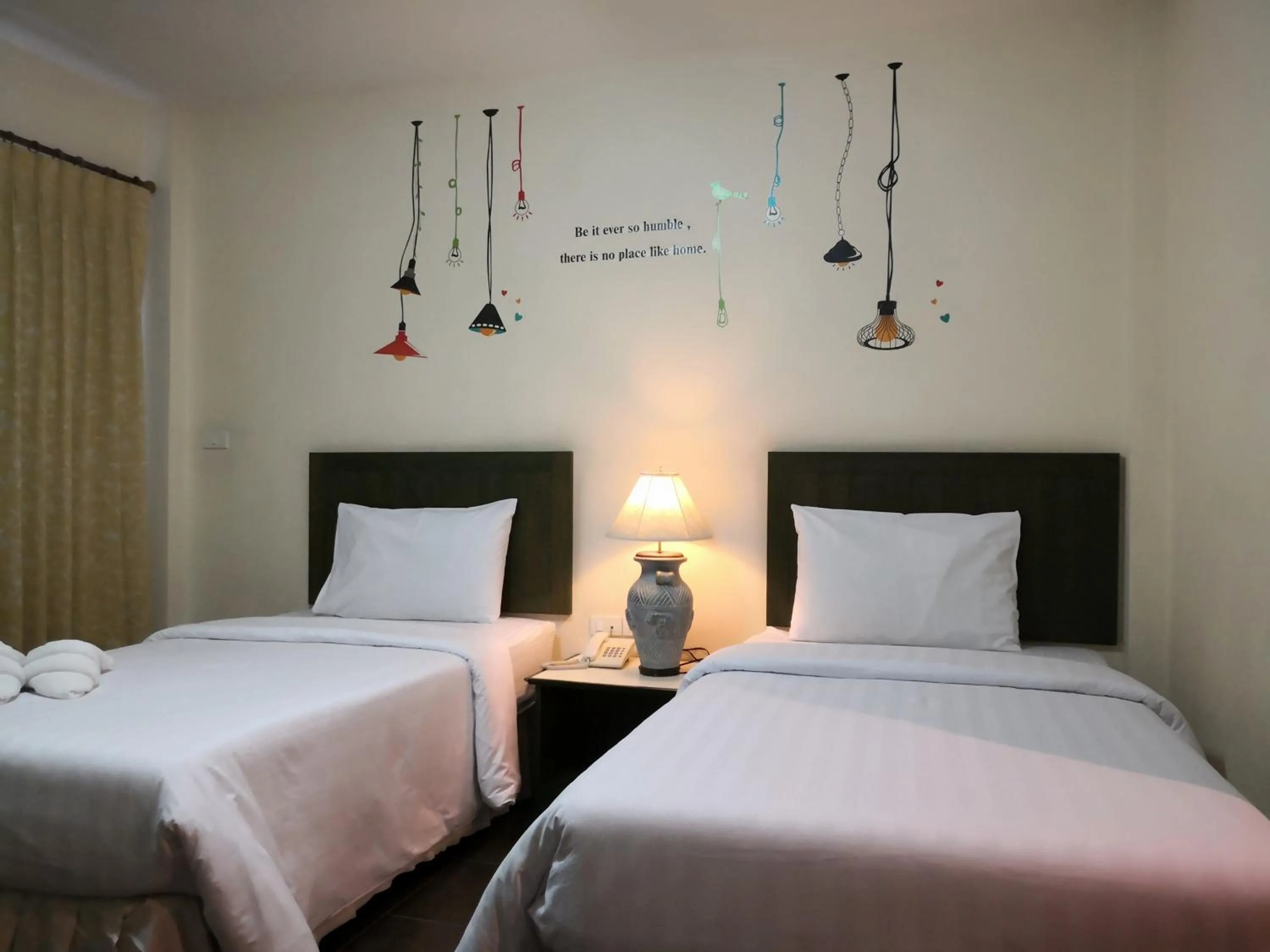 Bed in Baan Suksiri Hotel