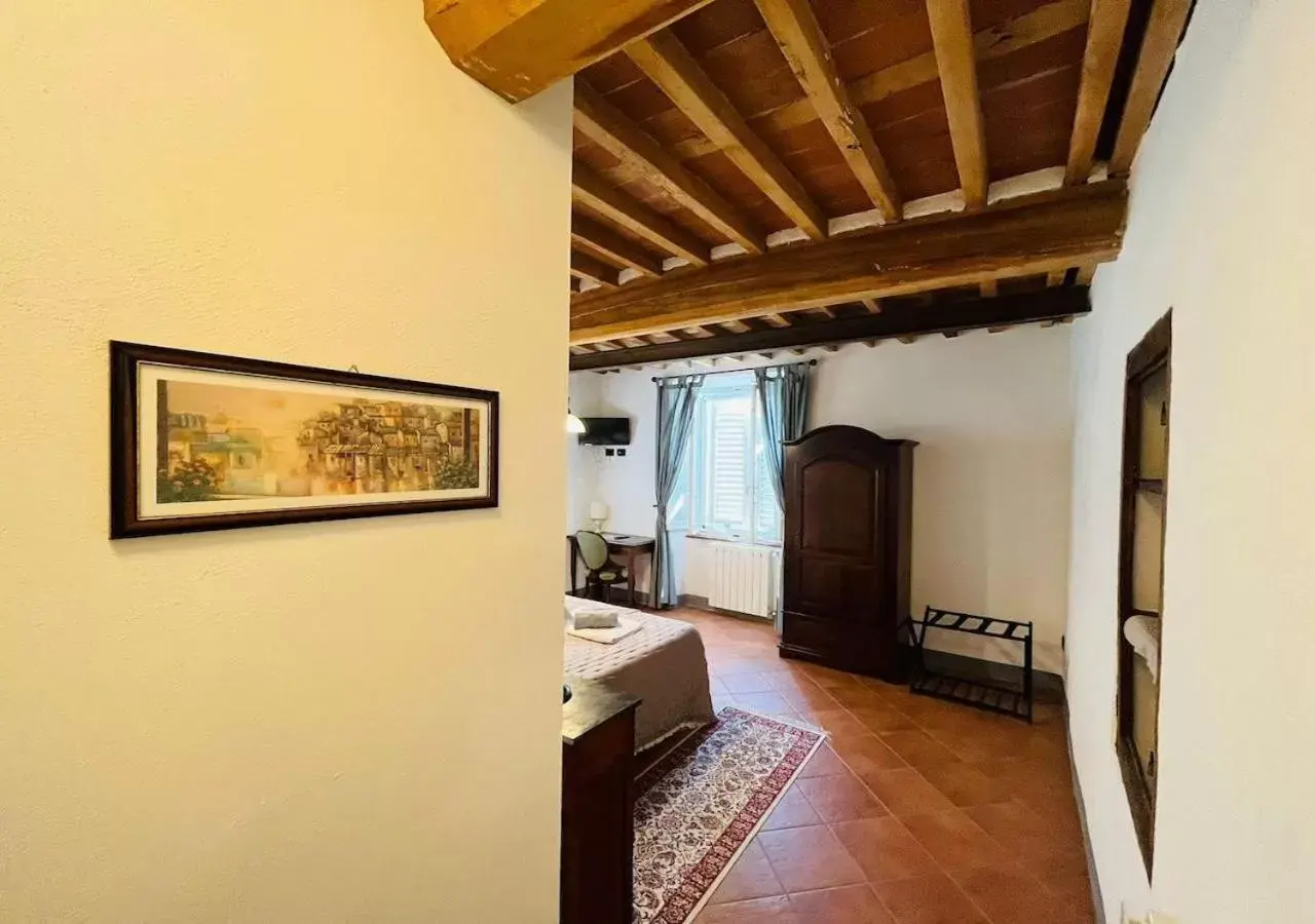 Photo of the whole room, TV/Entertainment Center in B&B Giardino delle Camelie