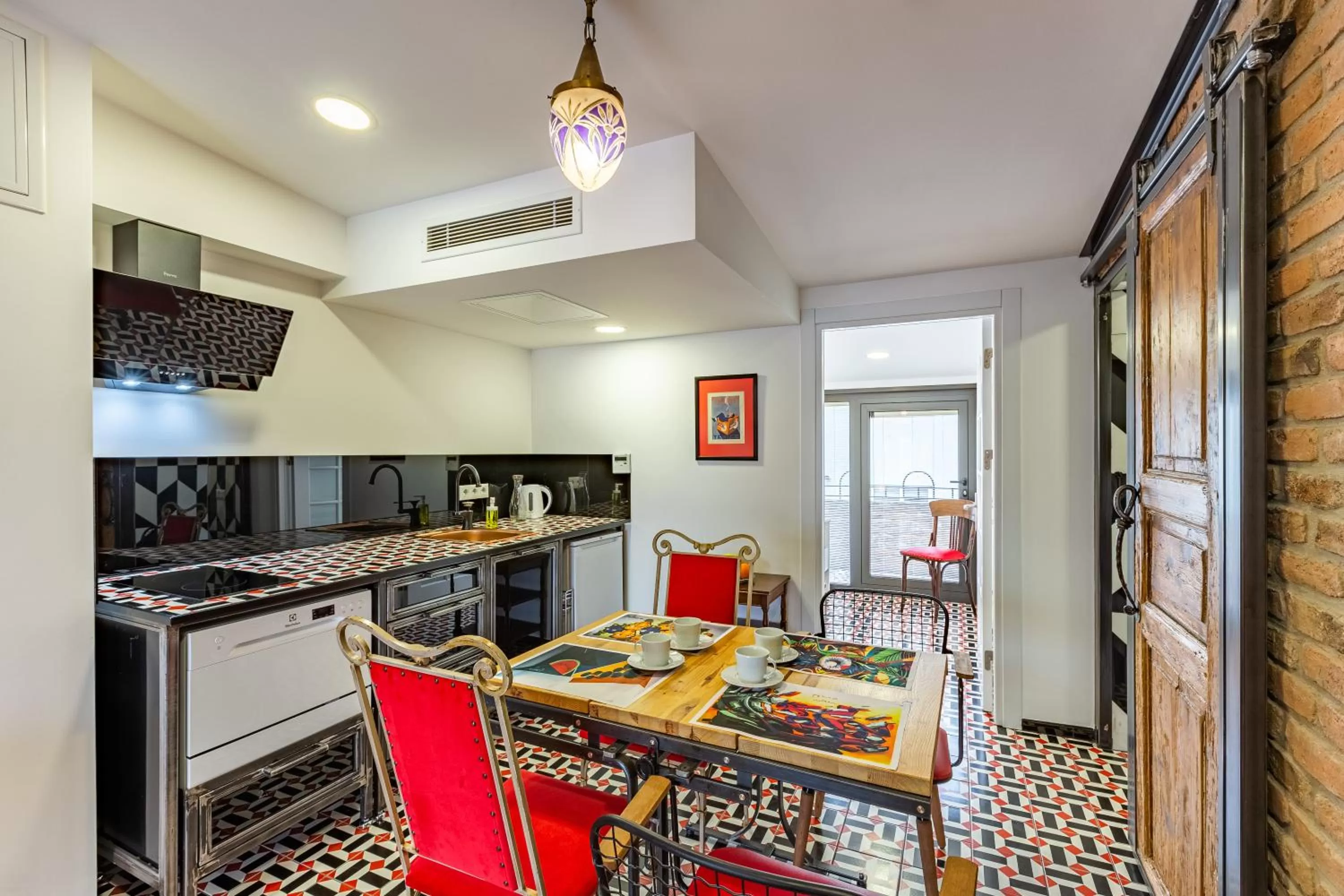 Kitchen or kitchenette in Villa Pera Suite Hotel