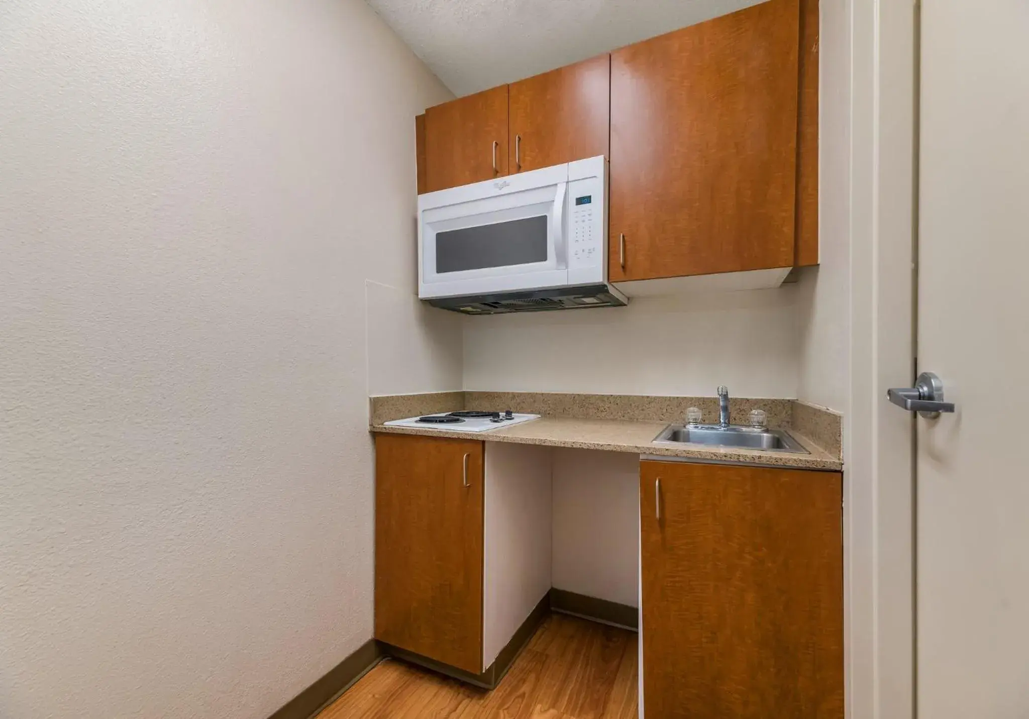 Kitchen or kitchenette, Kitchen/Kitchenette in HomeTowne Studios by Red Roof Orlando - UCF Area