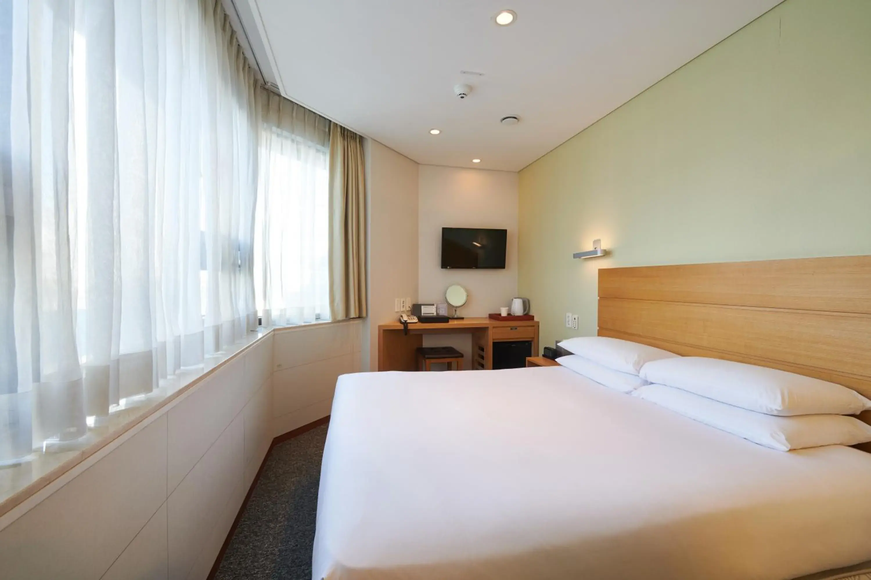 Bed in Nine Tree Hotel Myeongdong