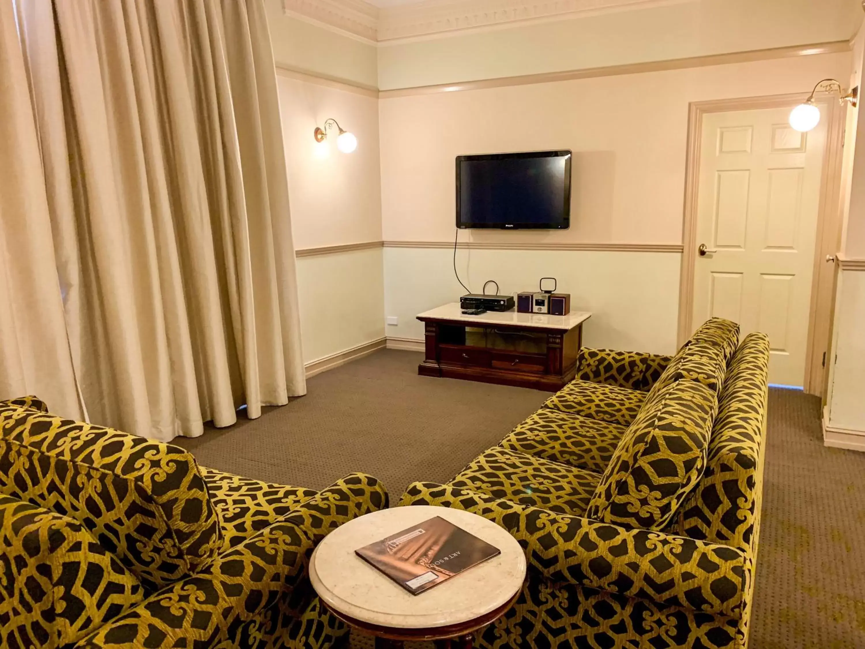 Communal lounge/ TV room, Seating Area in Royal Albert Hotel