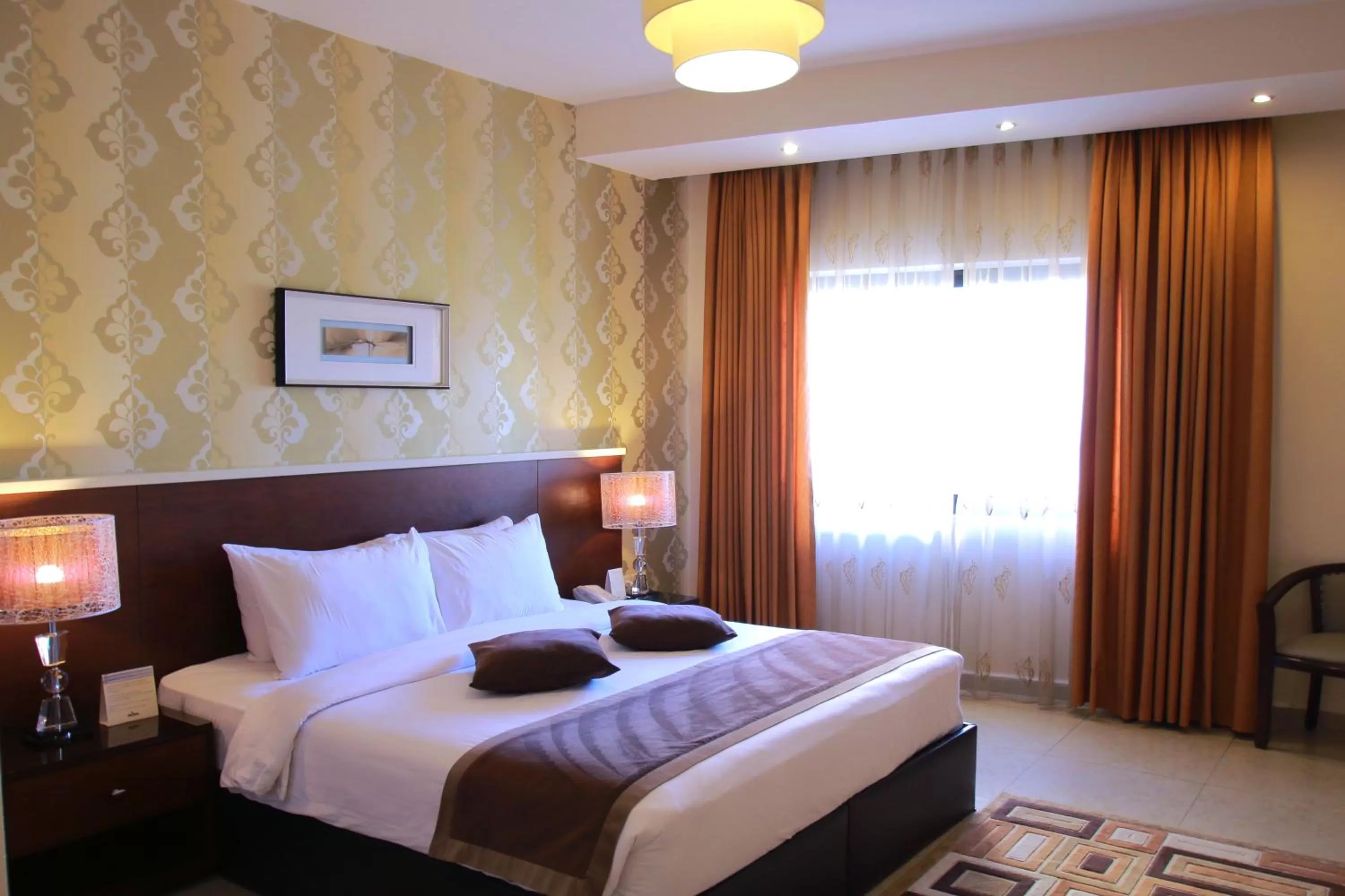 Bed in City Rose Hotel Suites