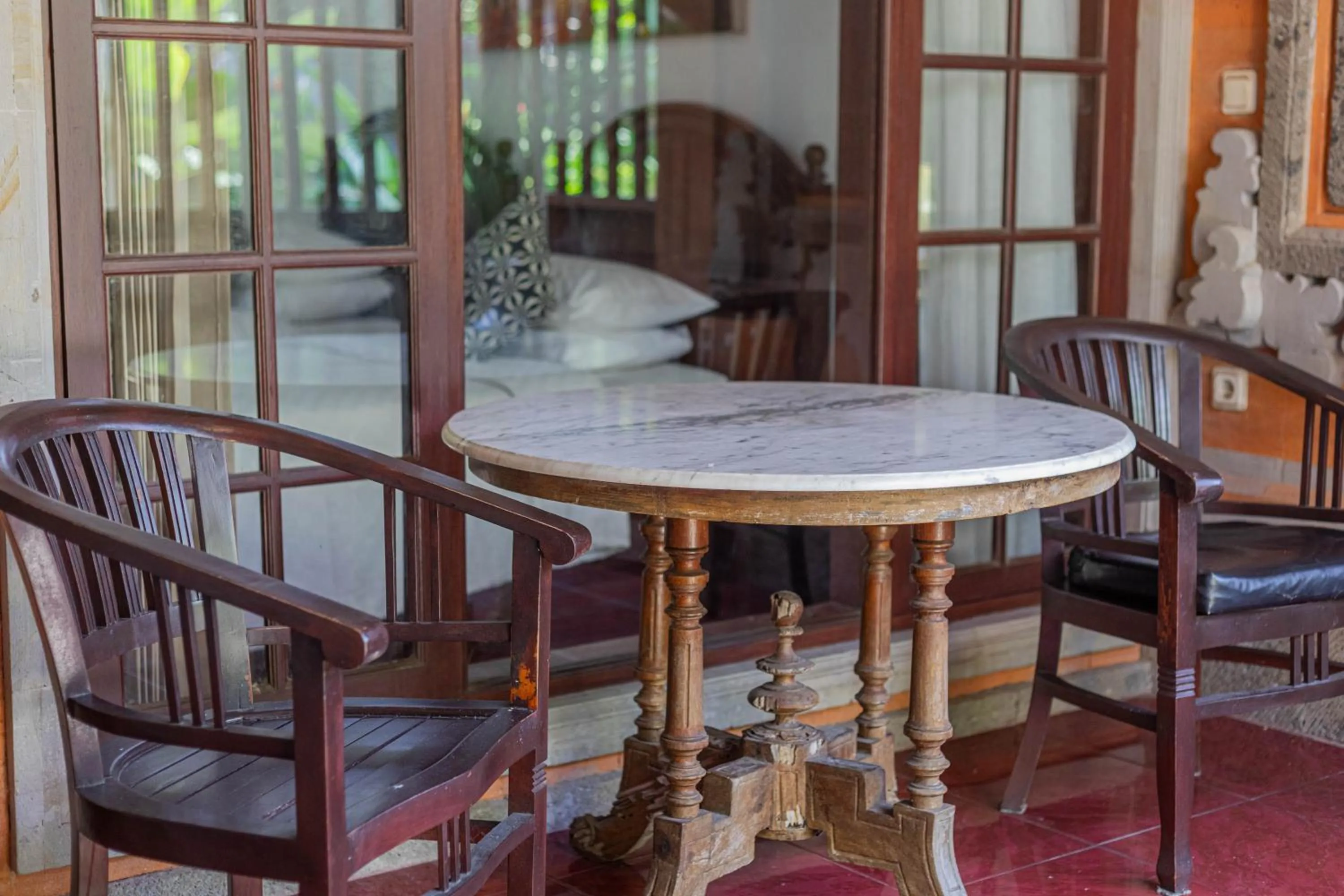 Seating area in Puri Mango Guest House Sanur