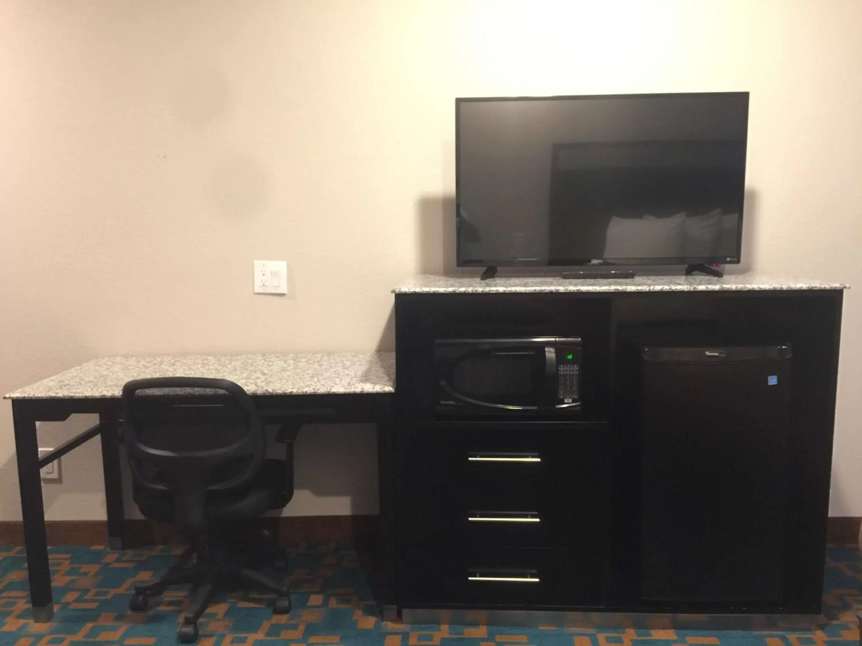 Photo of the whole room, TV/Entertainment Center in SureStay Hotel by Best Western Brownsville