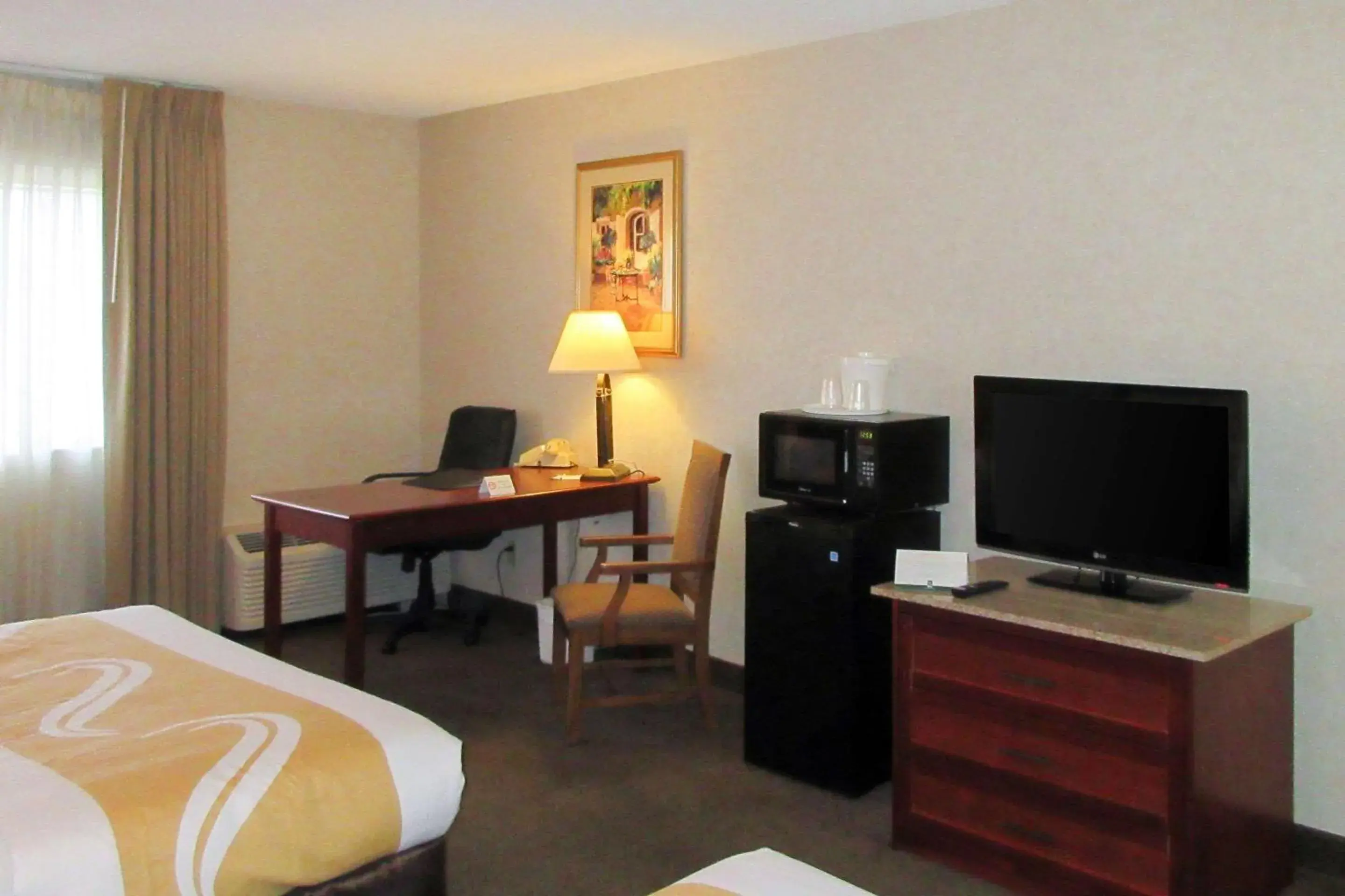 Photo of the whole room, TV/Entertainment Center in Quality Inn & Suites Albuquerque Downtown University