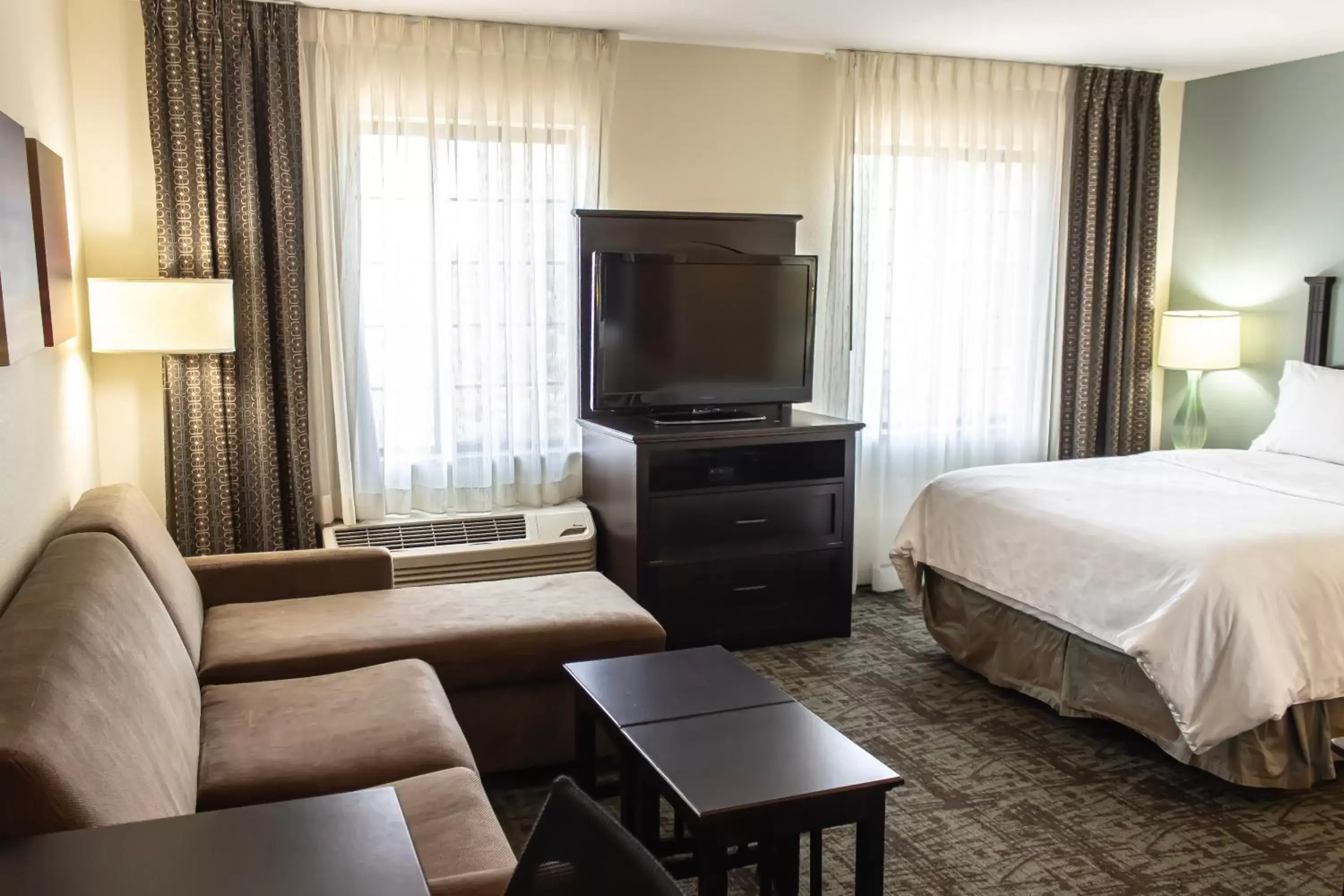 Photo of the whole room, TV/Entertainment Center in Staybridge Suites Minot, an IHG Hotel