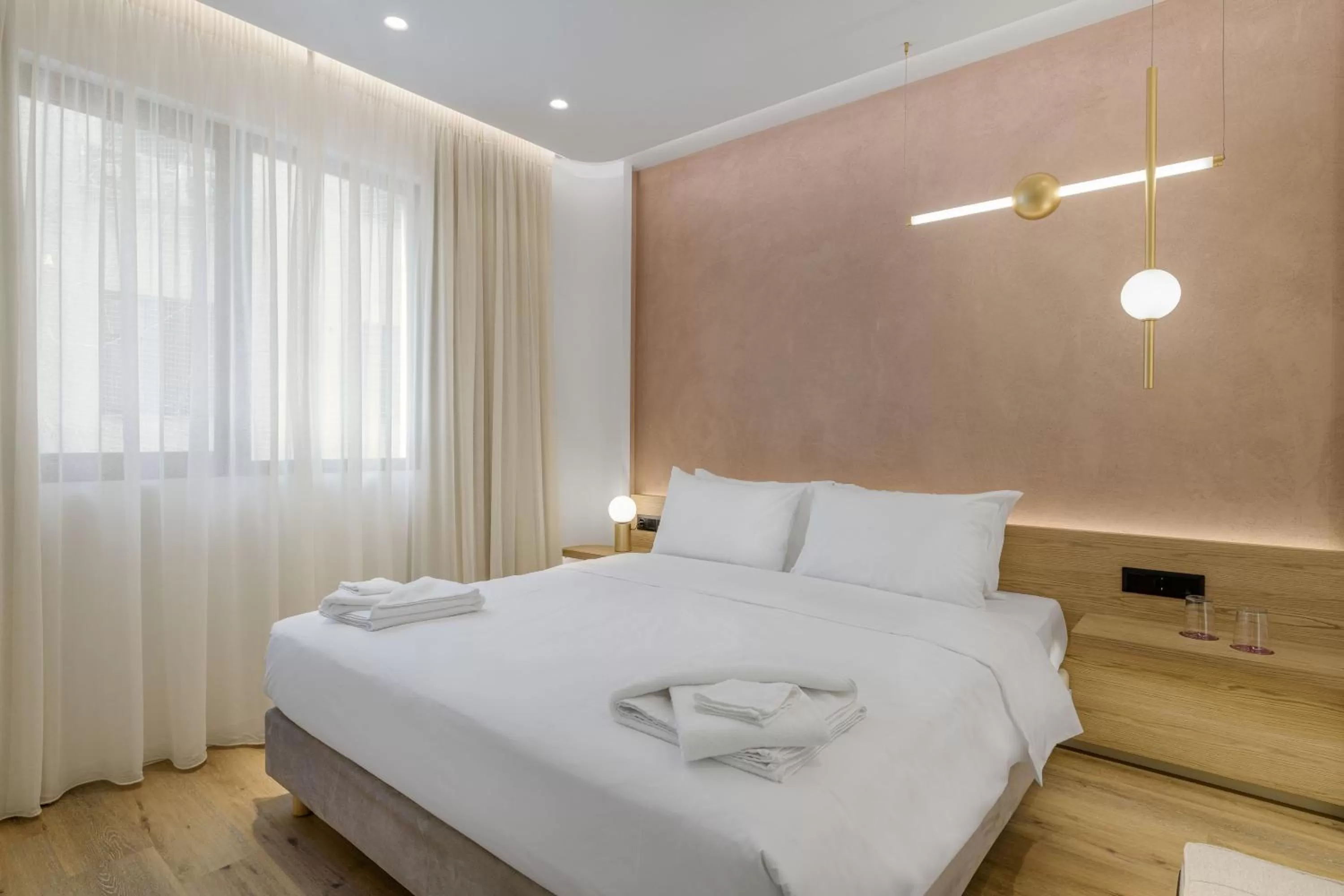 Bed in Acropolis Magenta Luxury Suites
