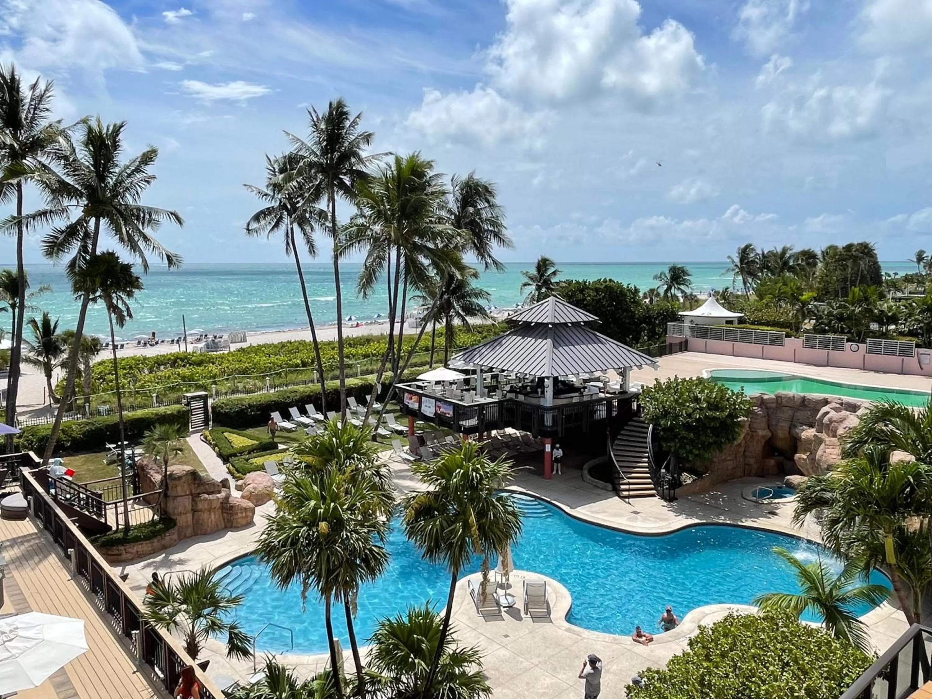 Lounge or bar, Pool View in The Alexander Beach Residences