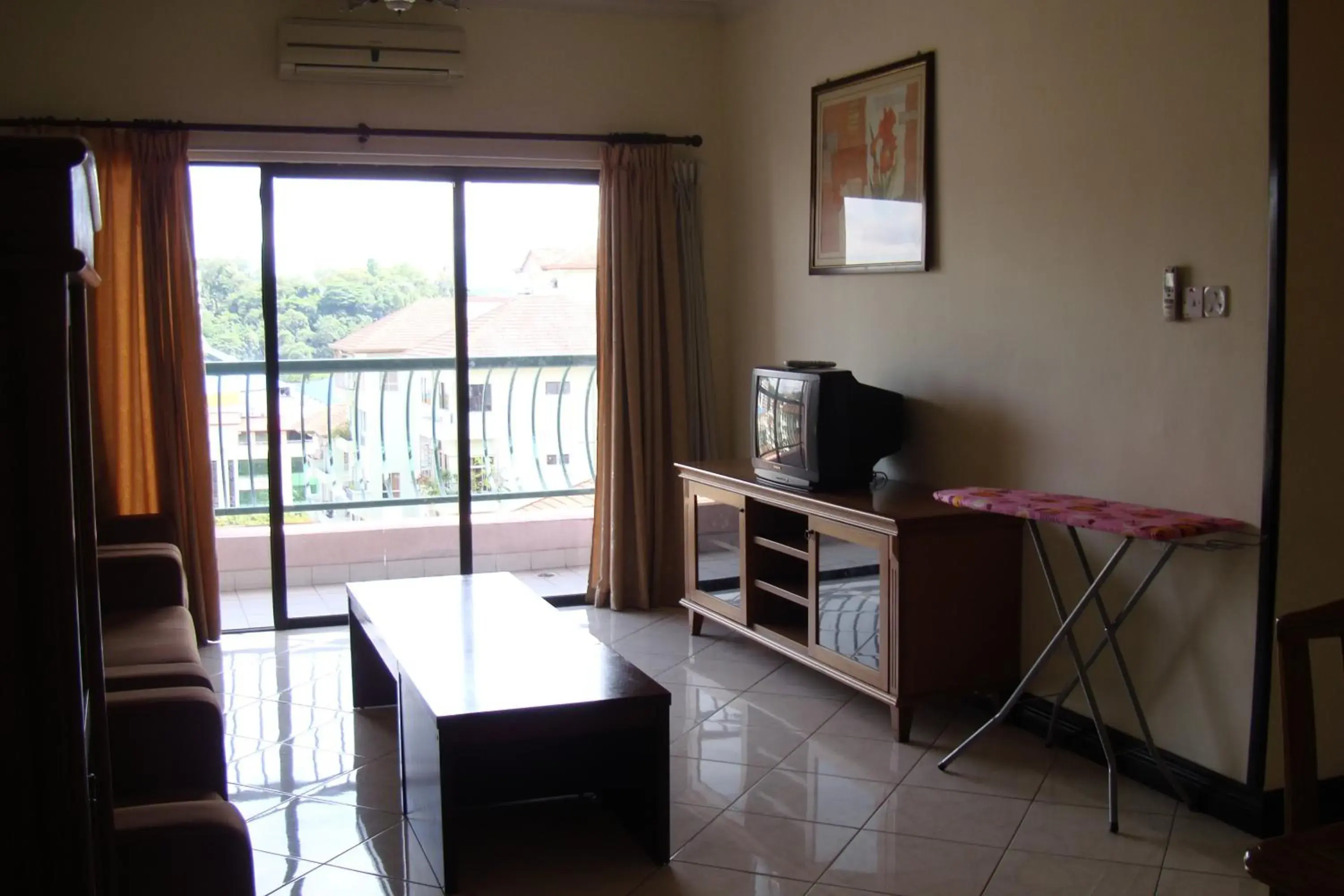 Living room, TV/Entertainment Center in Dorcas Service Apartment - Marina Court