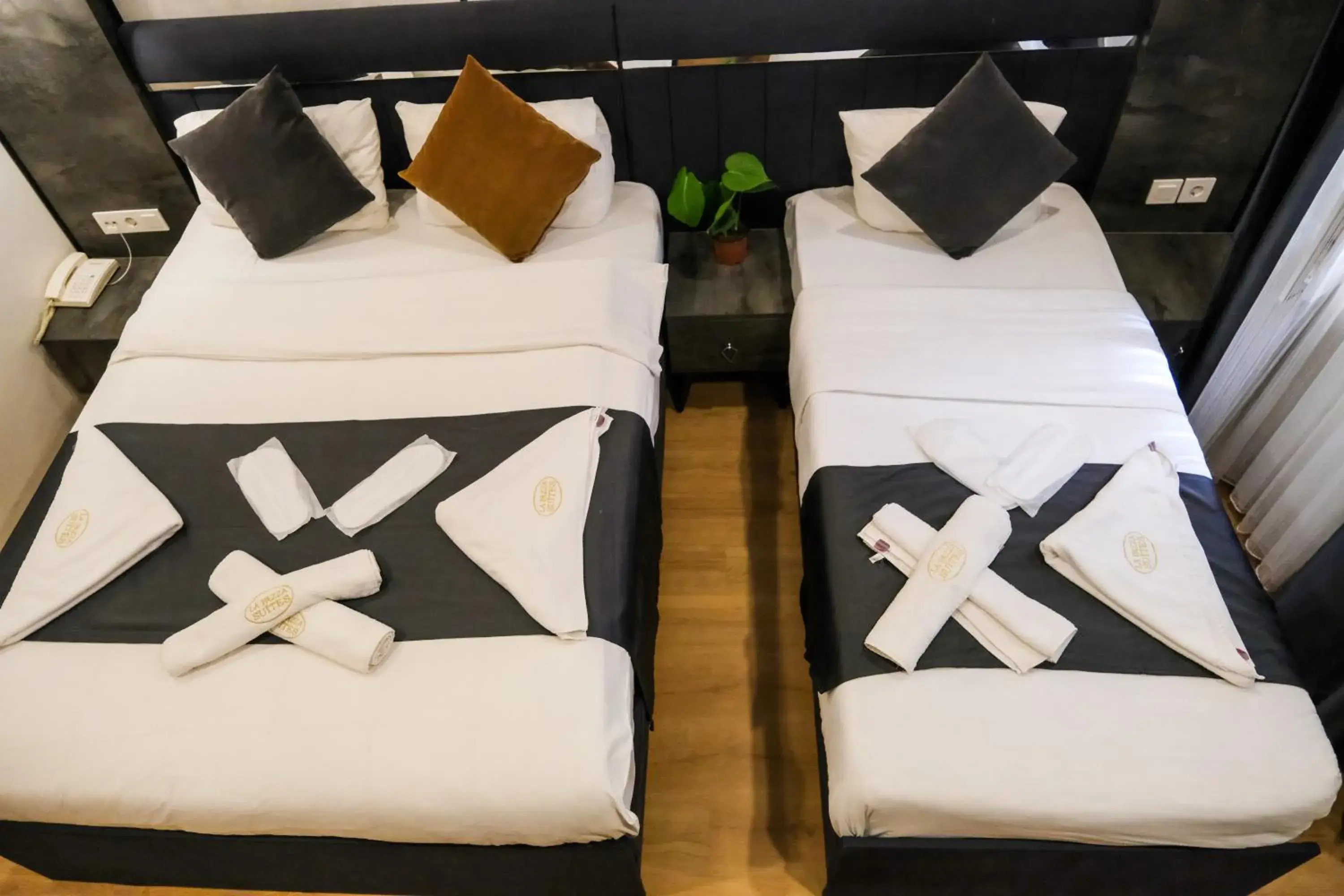 Bed in La Pazza Suites