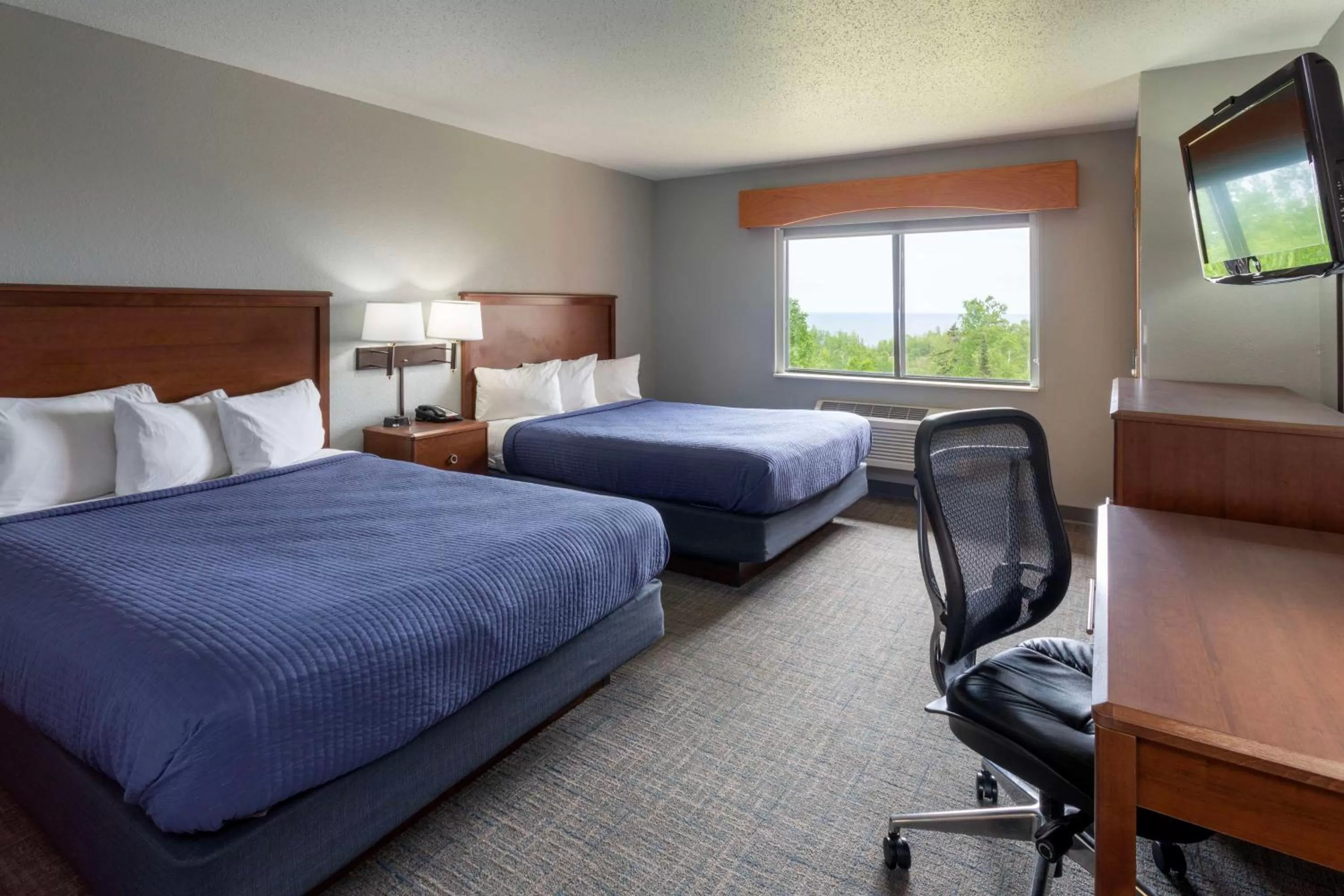Bedroom, Bed in Black Beach Inn by GrandStay