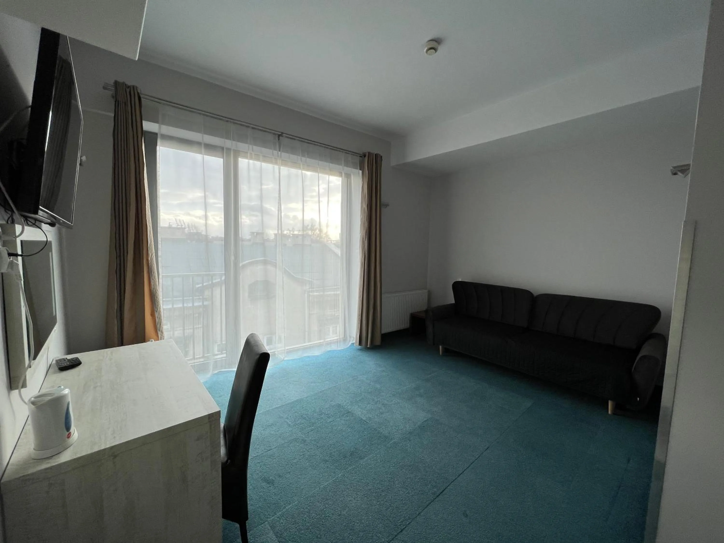 Communal lounge/ TV room in Hotel Poleski