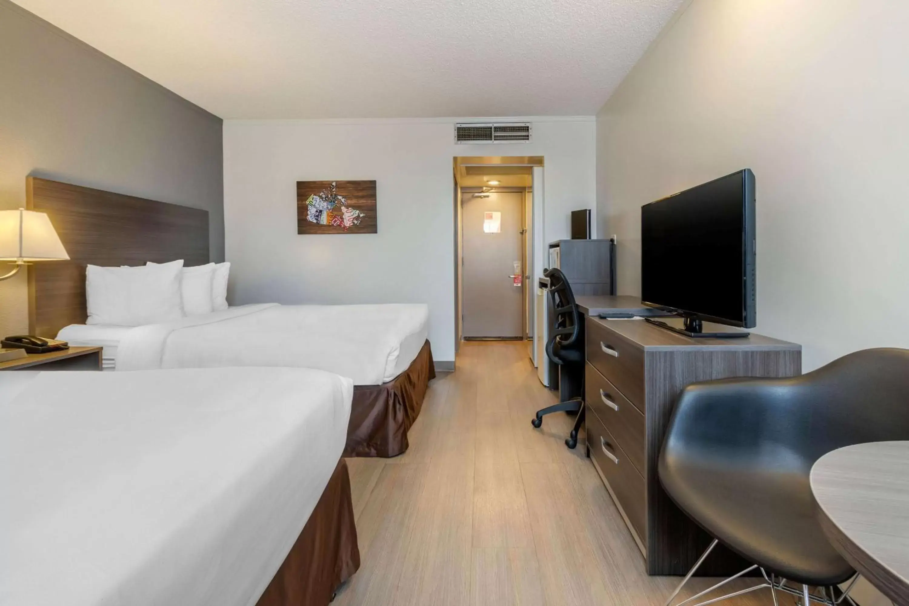 Photo of the whole room, TV/Entertainment Center in Super 8 by Wyndham Macleod Trail Calgary
