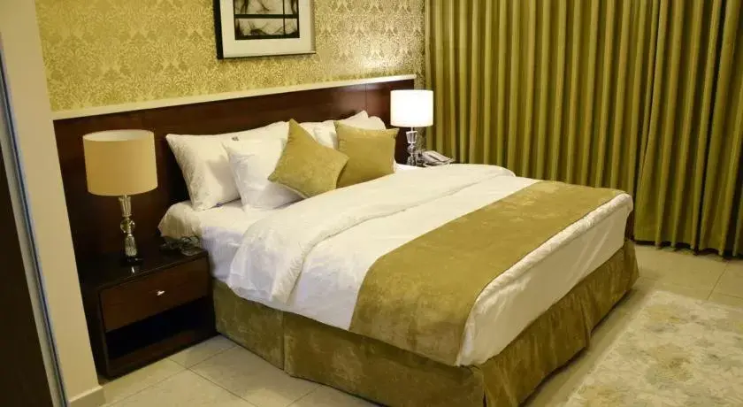 Bed in City Rose Hotel Suites