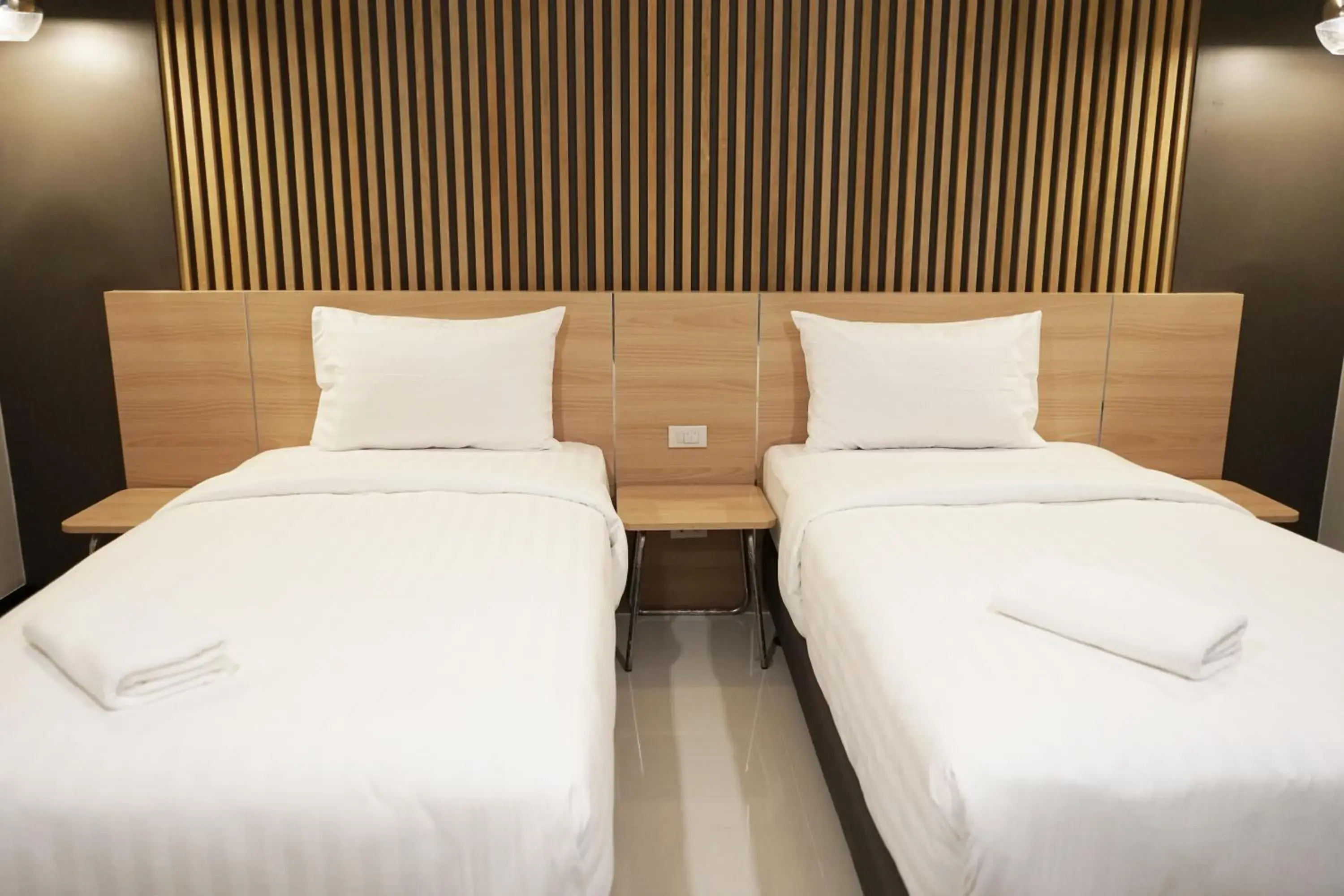 Bed in So good Hotel Bangkok
