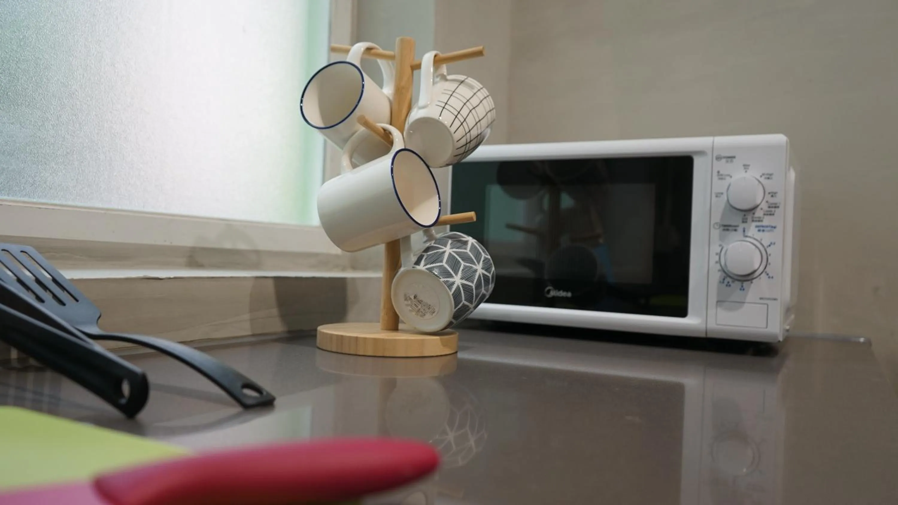 Communal kitchen in Homy Inn North Point