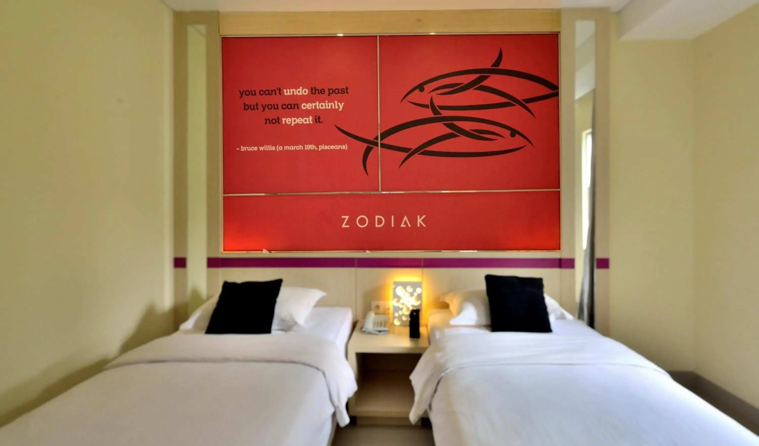 Bed in Zodiak Kebon Kawung by KAGUM Hotels