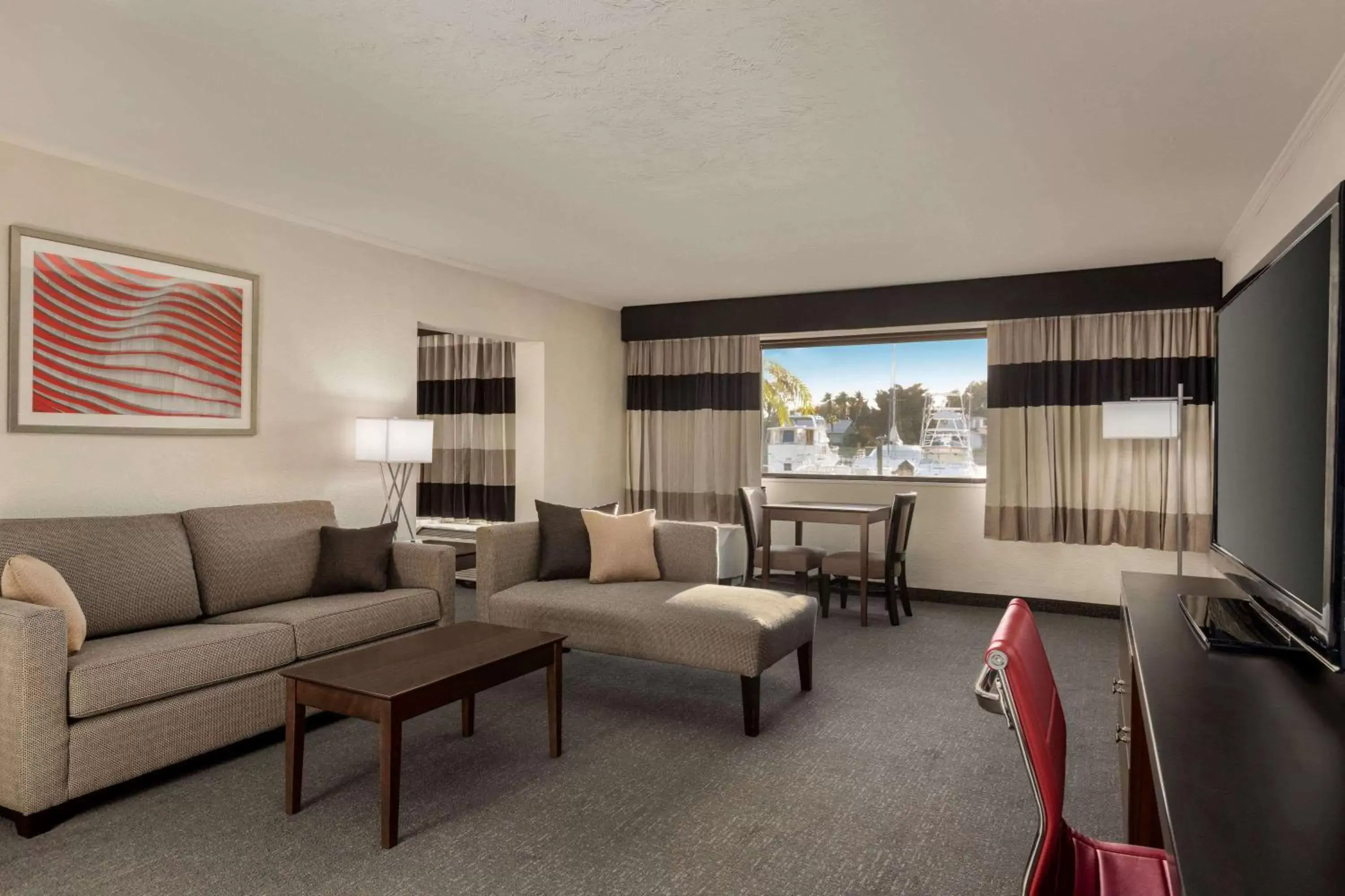 Photo of the whole room, Seating Area in Ramada by Wyndham Sarasota Waterfront
