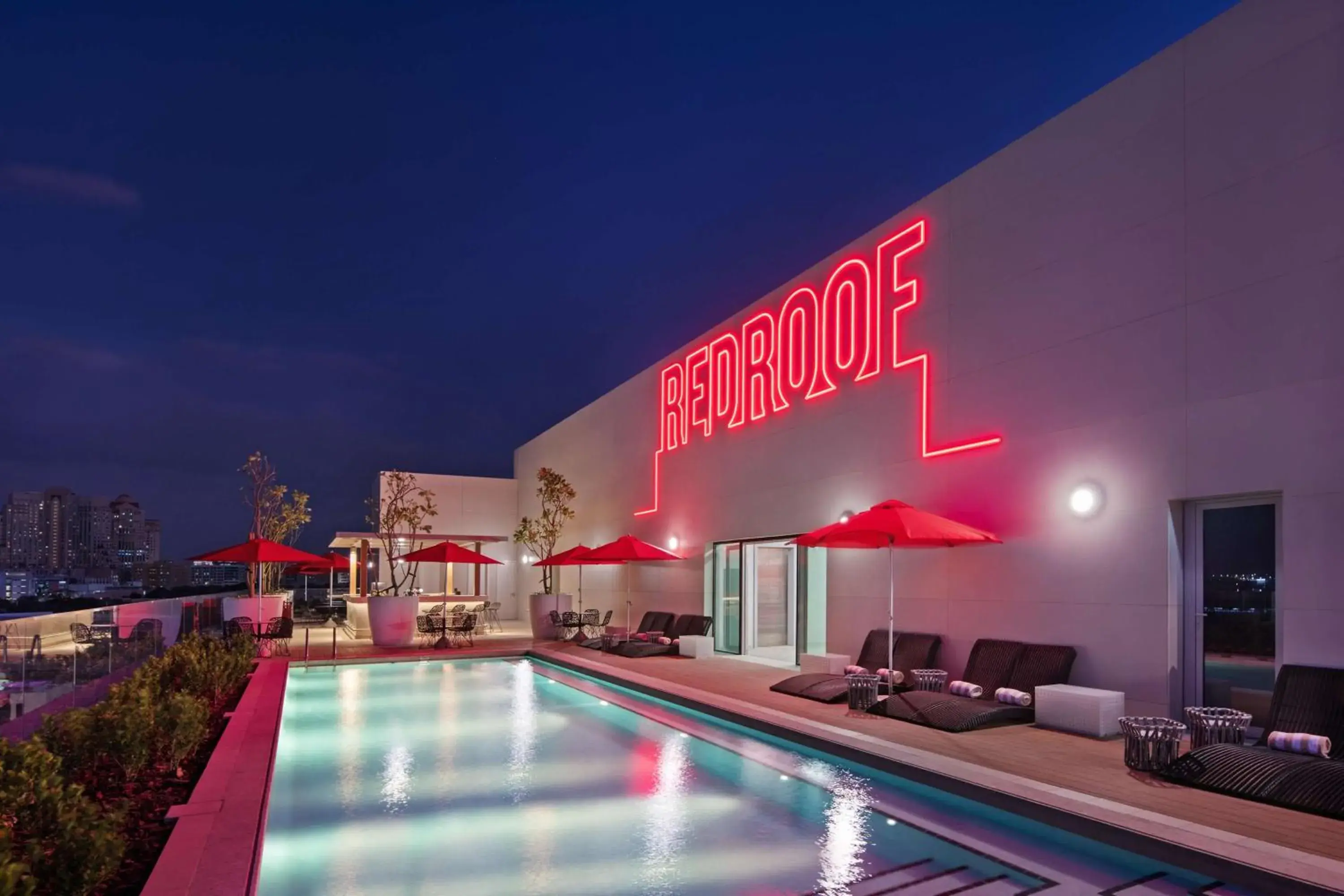 Lounge or bar, Swimming Pool in Radisson RED Dubai Silicon Oasis