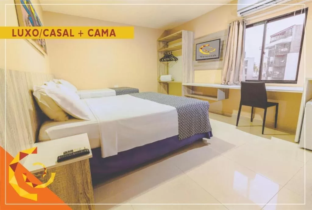 Bed in Netuanah Praia Hotel