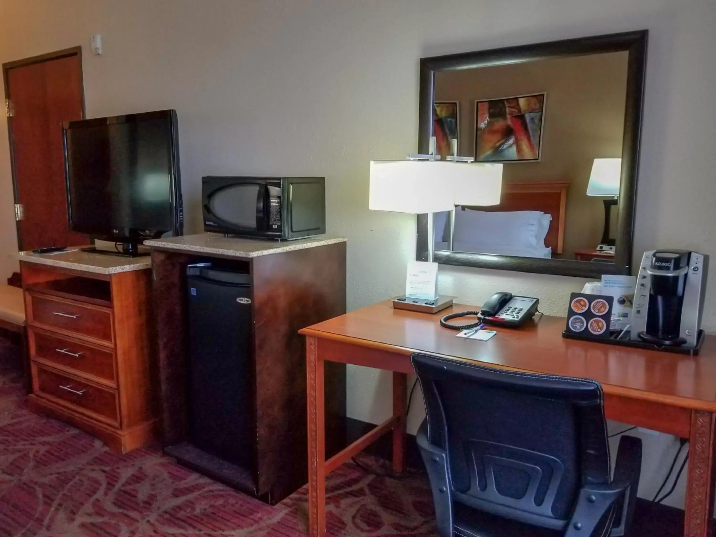 Photo of the whole room, TV/Entertainment Center in Holiday Inn Express Hotel & Suites Orange City - Deltona, an IHG Hotel