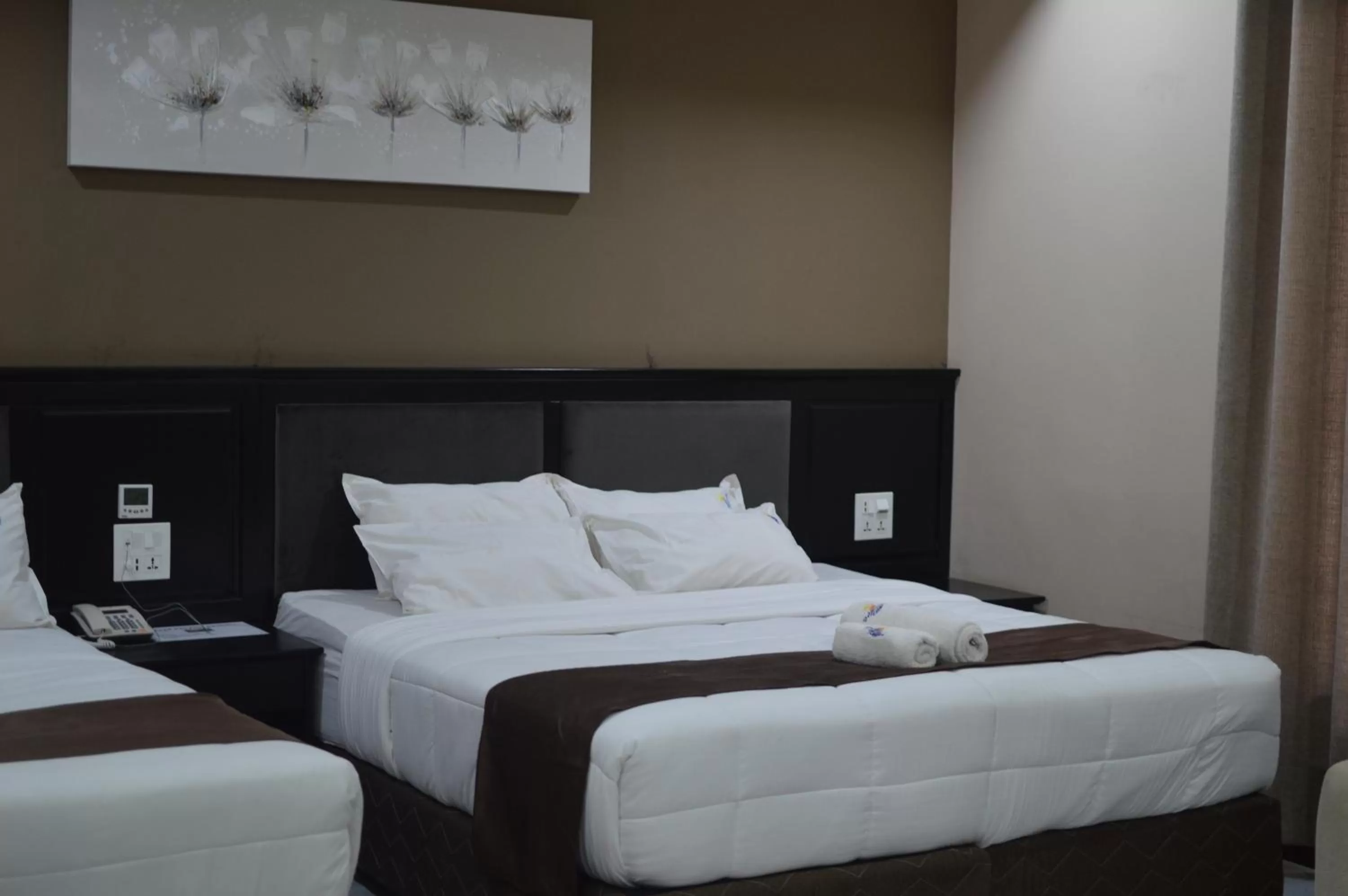 Bed in Palm Kalash Hotel