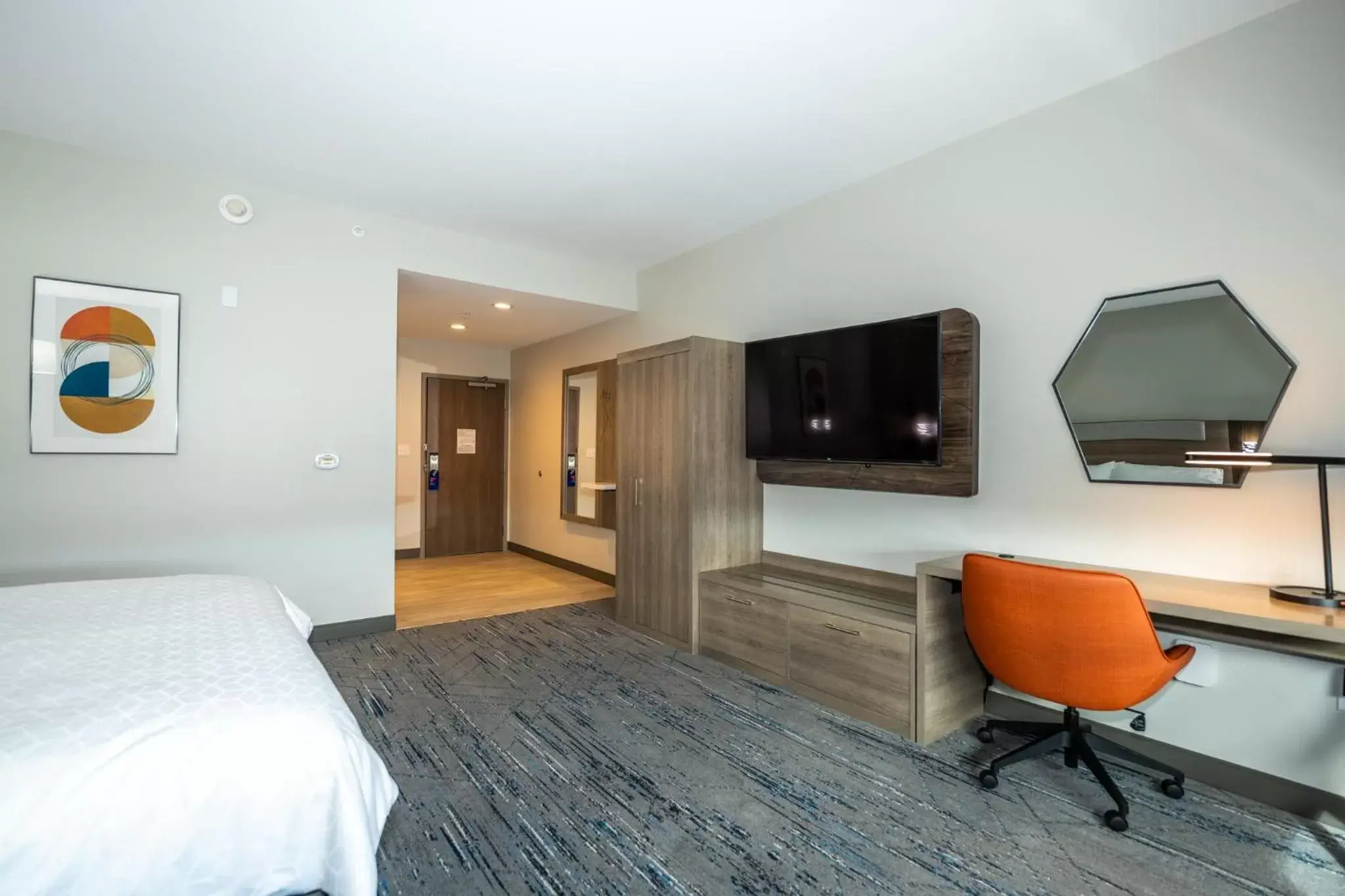 Photo of the whole room, TV/Entertainment Center in Holiday Inn Express & Suites Charlottesville, an IHG Hotel