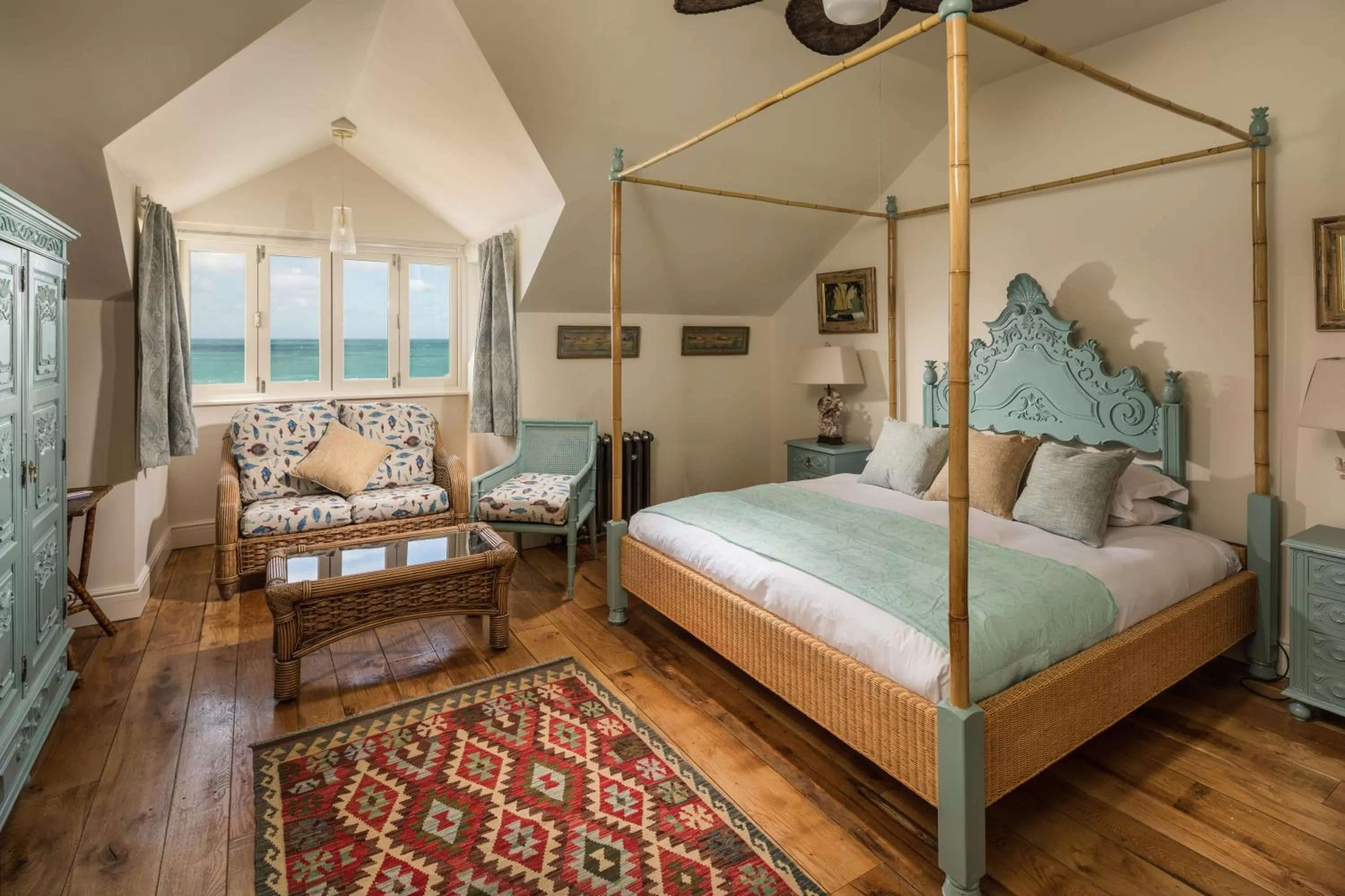 Seating area, Bed in Tolcarne Beach Colonial Restaurant and Rooms