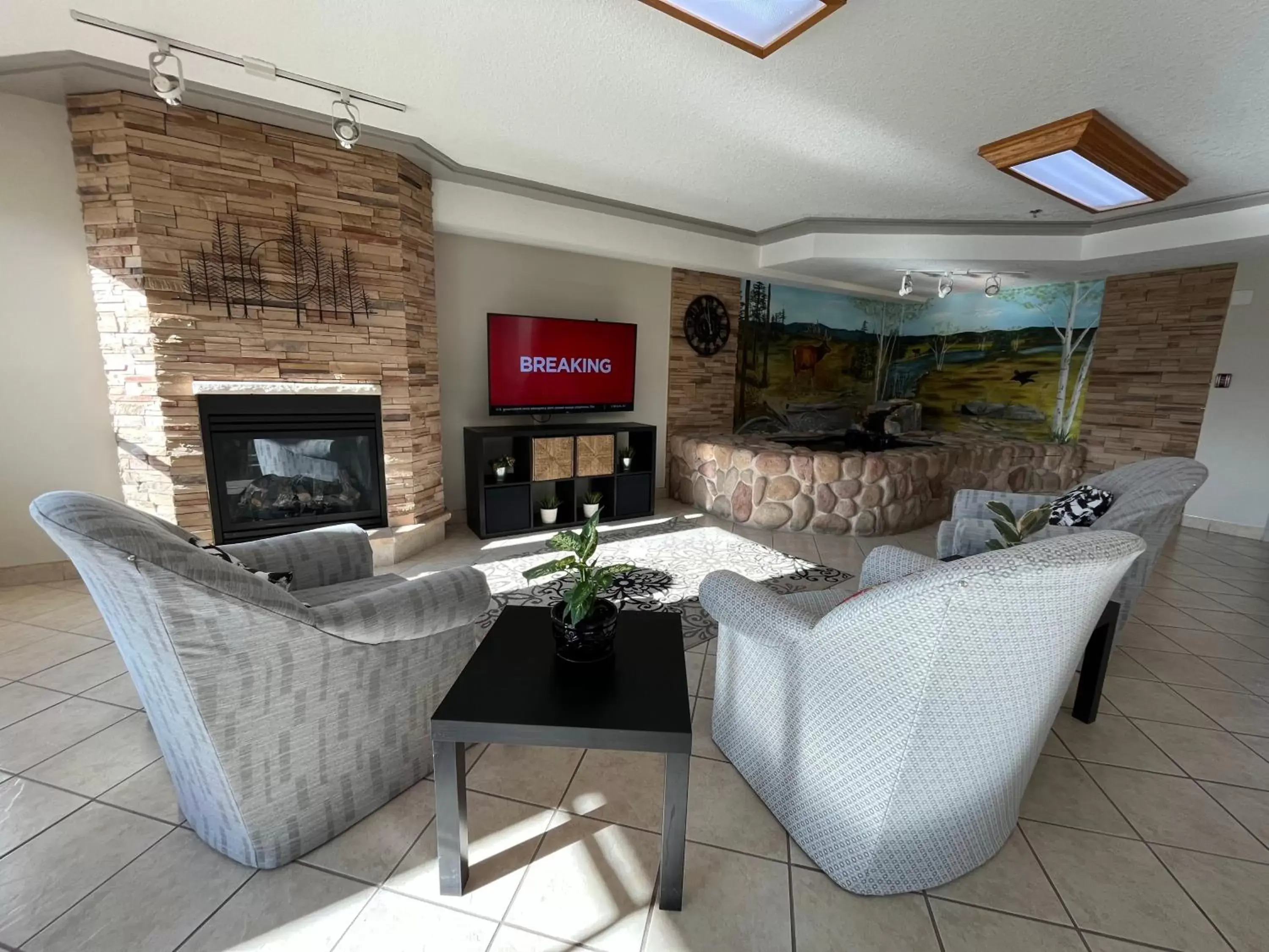 Communal lounge/ TV room, Seating Area in Western Budget Motel #3 Whitecourt