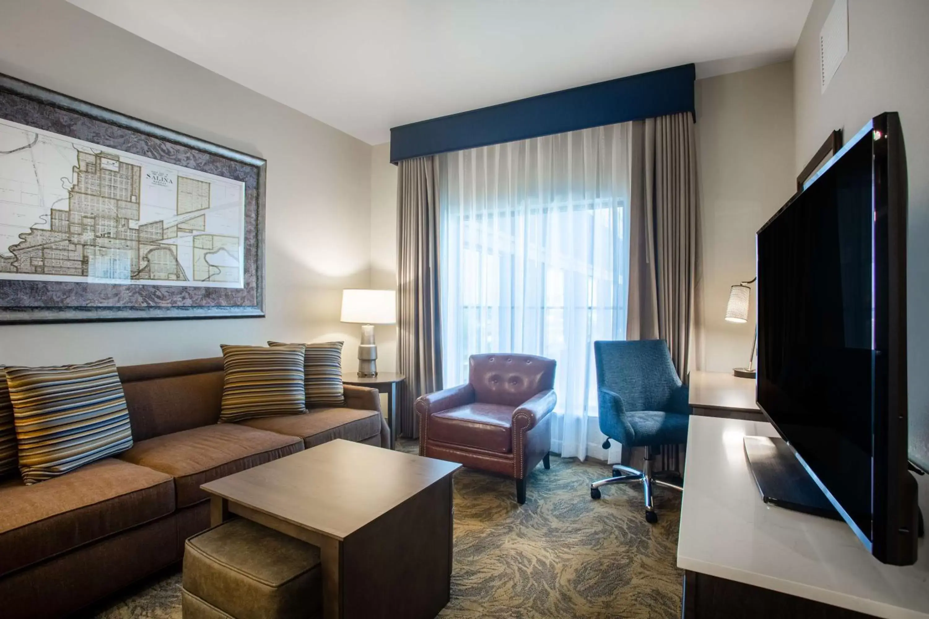 Bedroom, Seating Area in Homewood Suites By Hilton Salina/Downtown, Ks