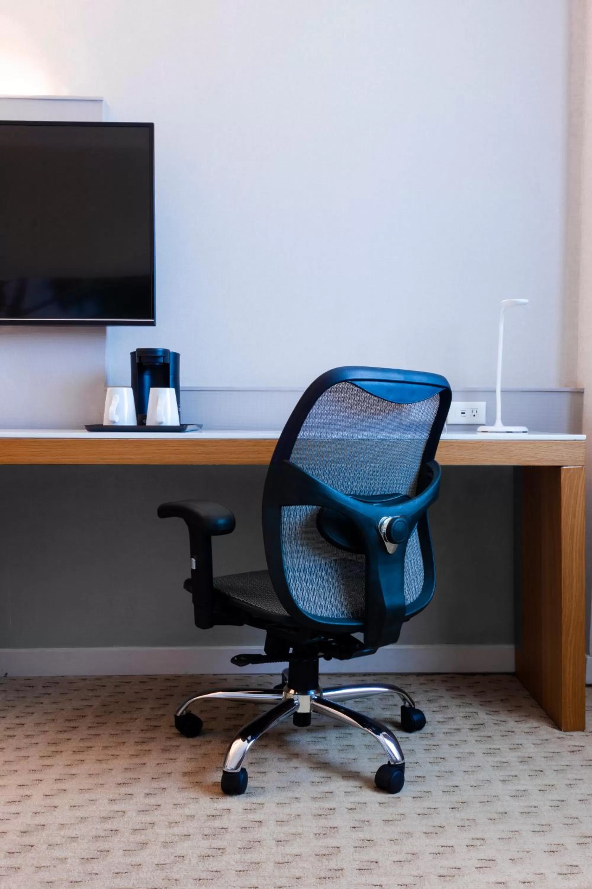 Communal lounge/ TV room in Crowne Plaza Managua by IHG