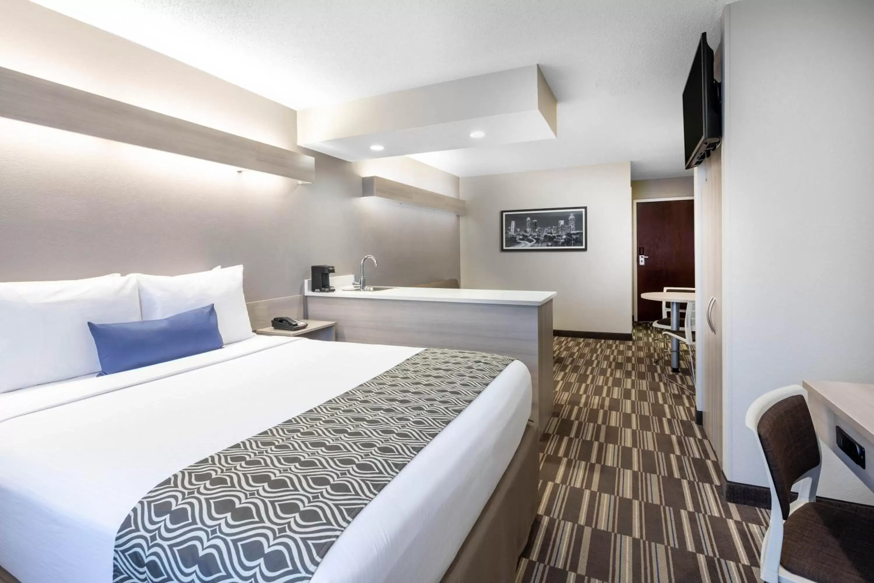 Bed in Microtel Inn & Suites by Wyndham Atlanta Buckhead Area