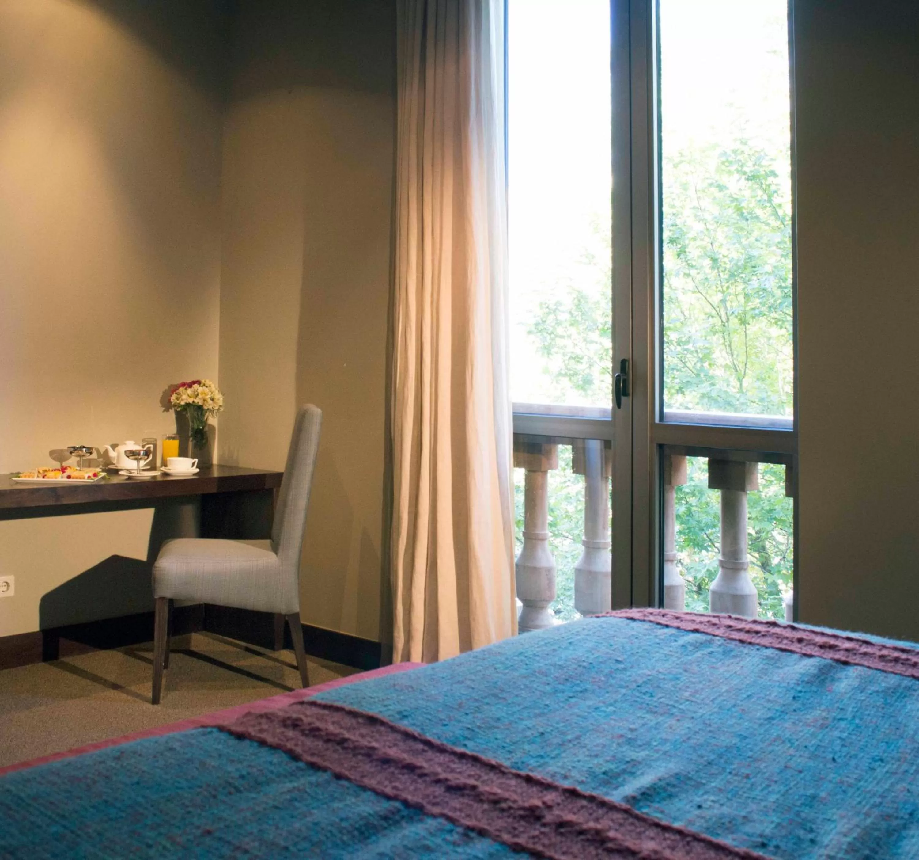 Bed in Tufenkian Historic Yerevan Hotel