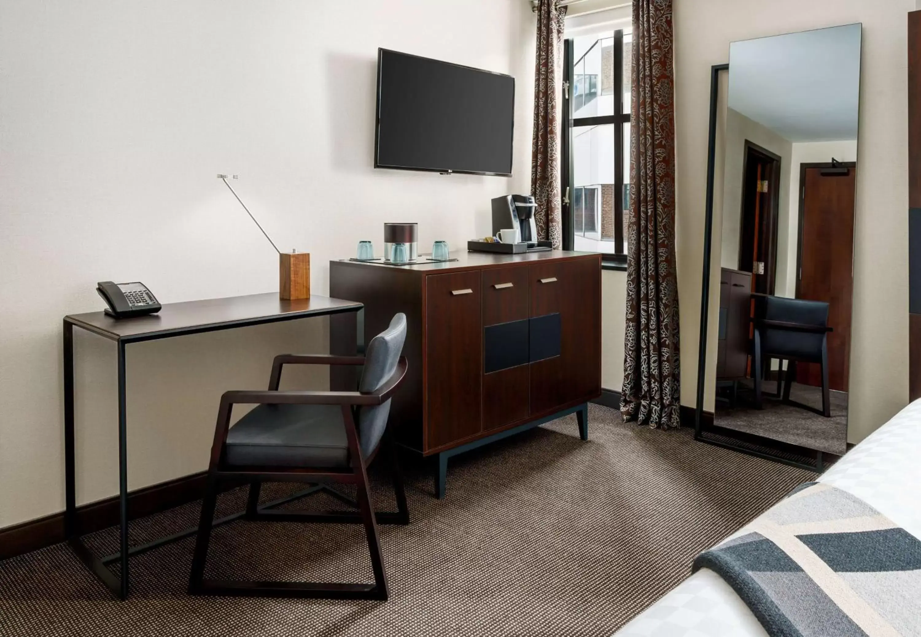 Bedroom, TV/Entertainment Center in Joinery Hotel Pittsburgh, Curio Collection by Hilton