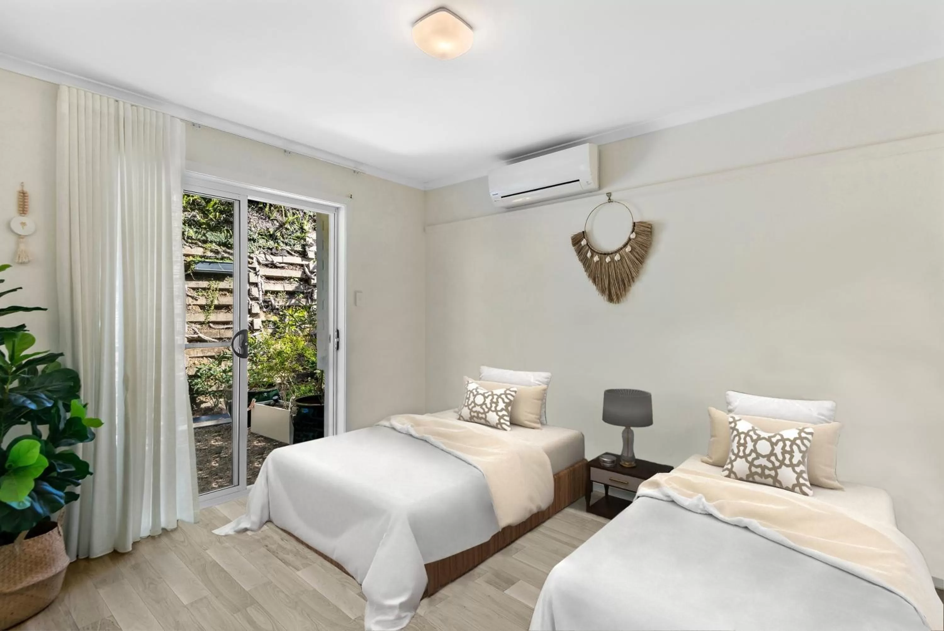 Bed in The Oasis Apartments and Treetop Houses