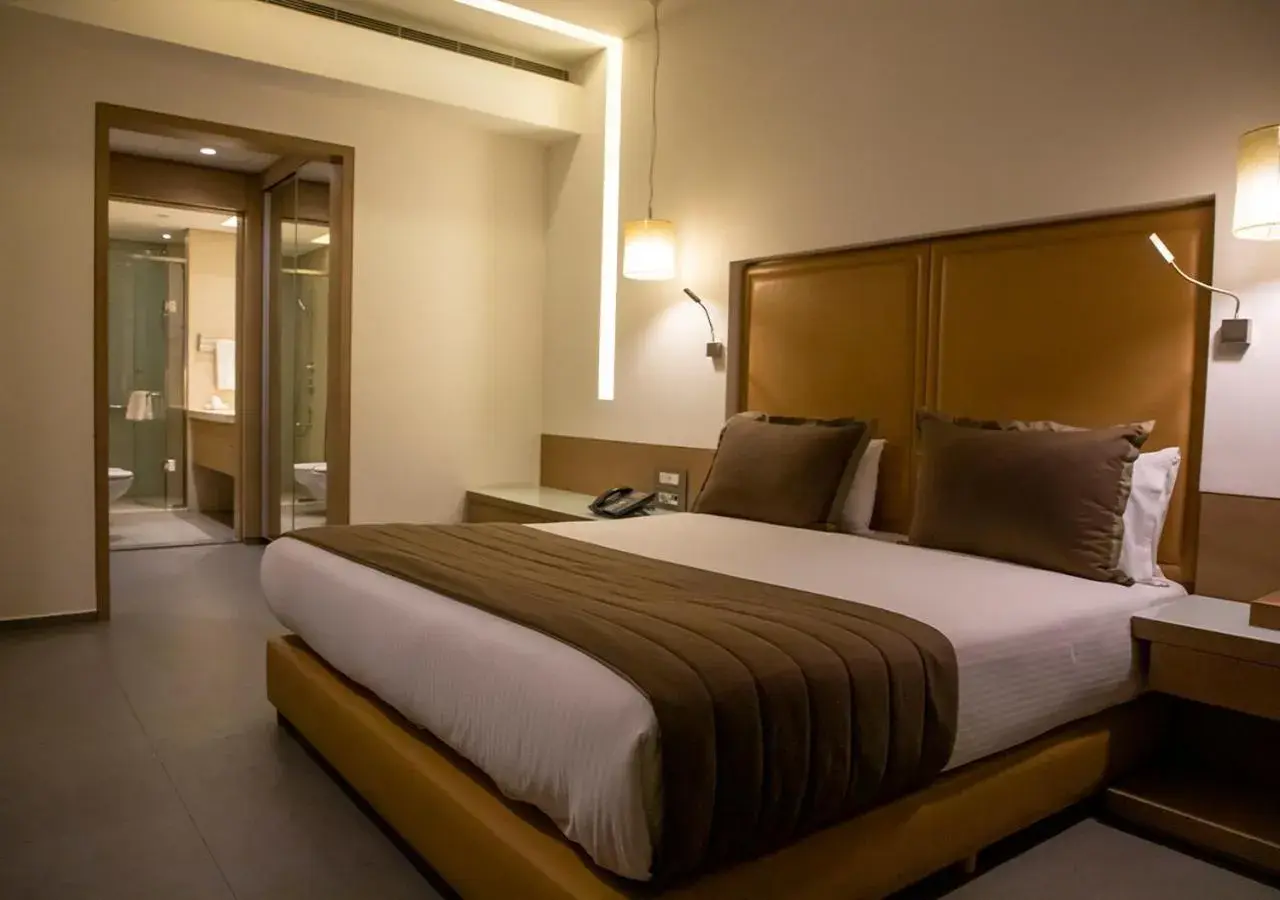 Bed in Saifi Suites