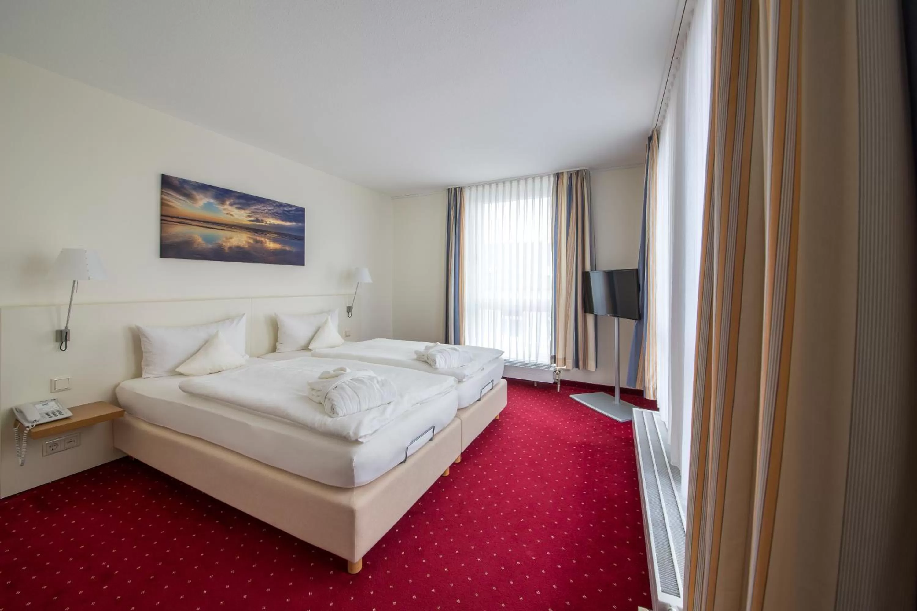 Photo of the whole room, Bed in Michels Strandhotel Germania