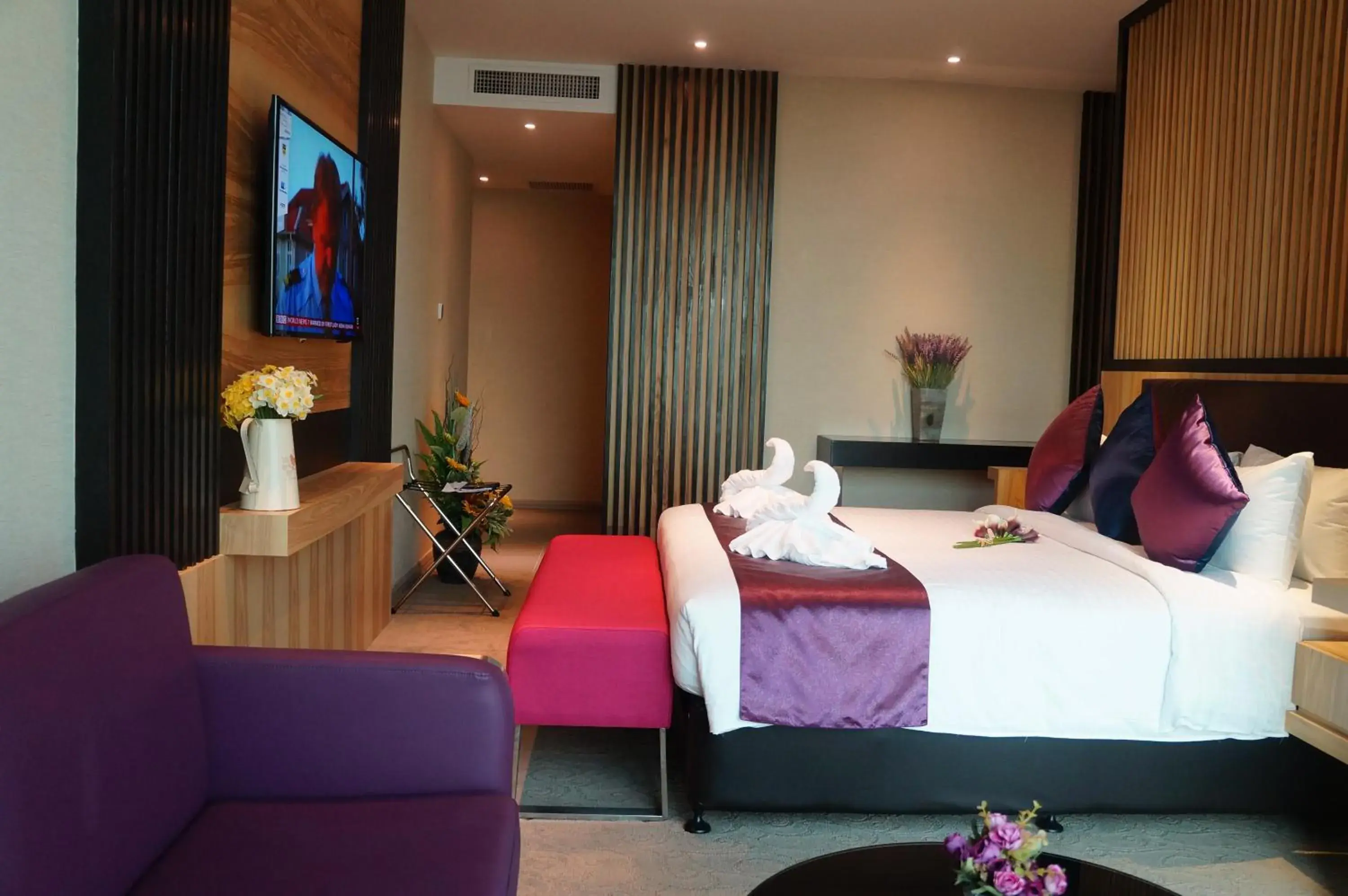 Bedroom in Greens Hotel & Suites