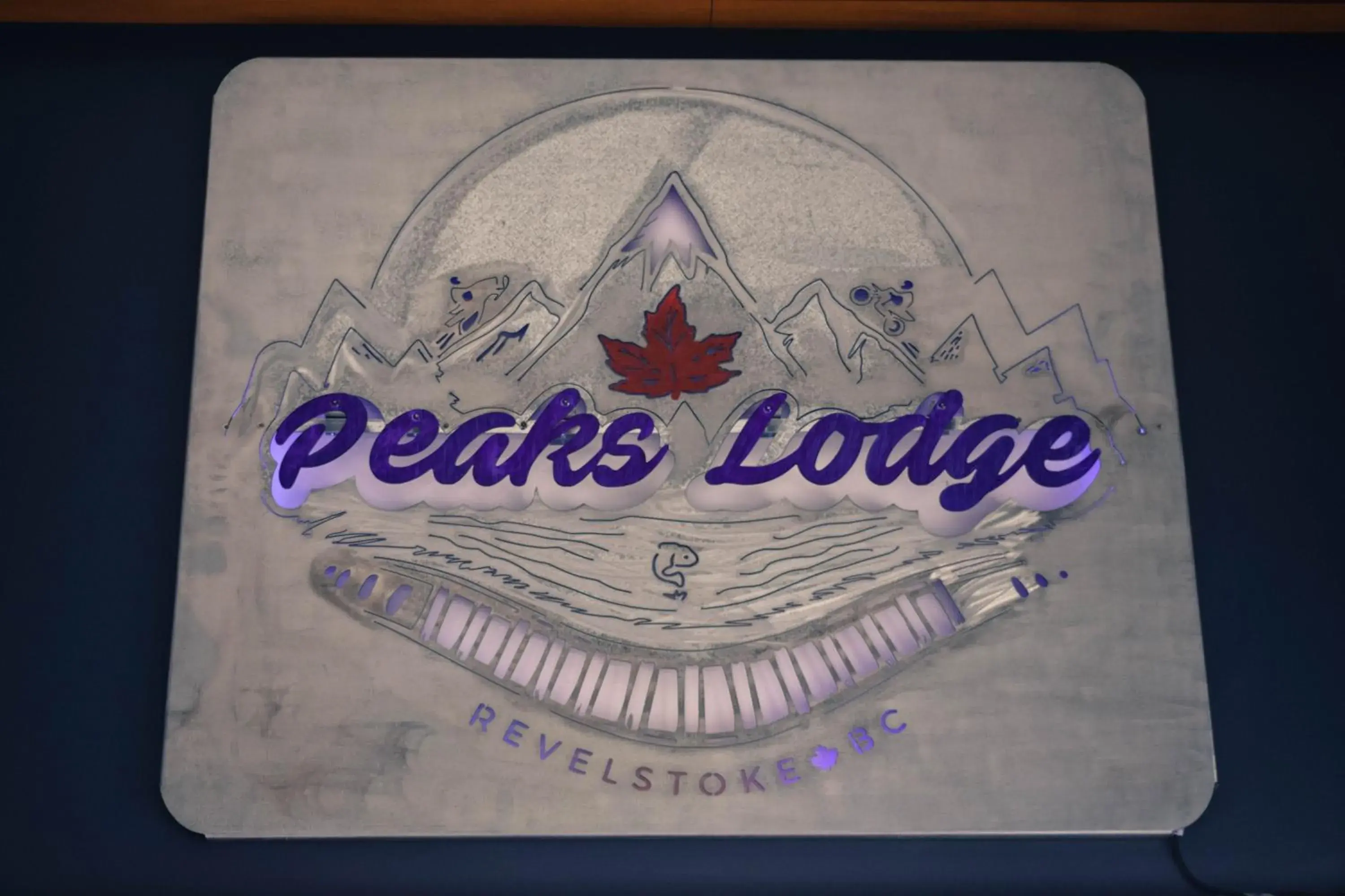 Property logo or sign in Peaks Lodge