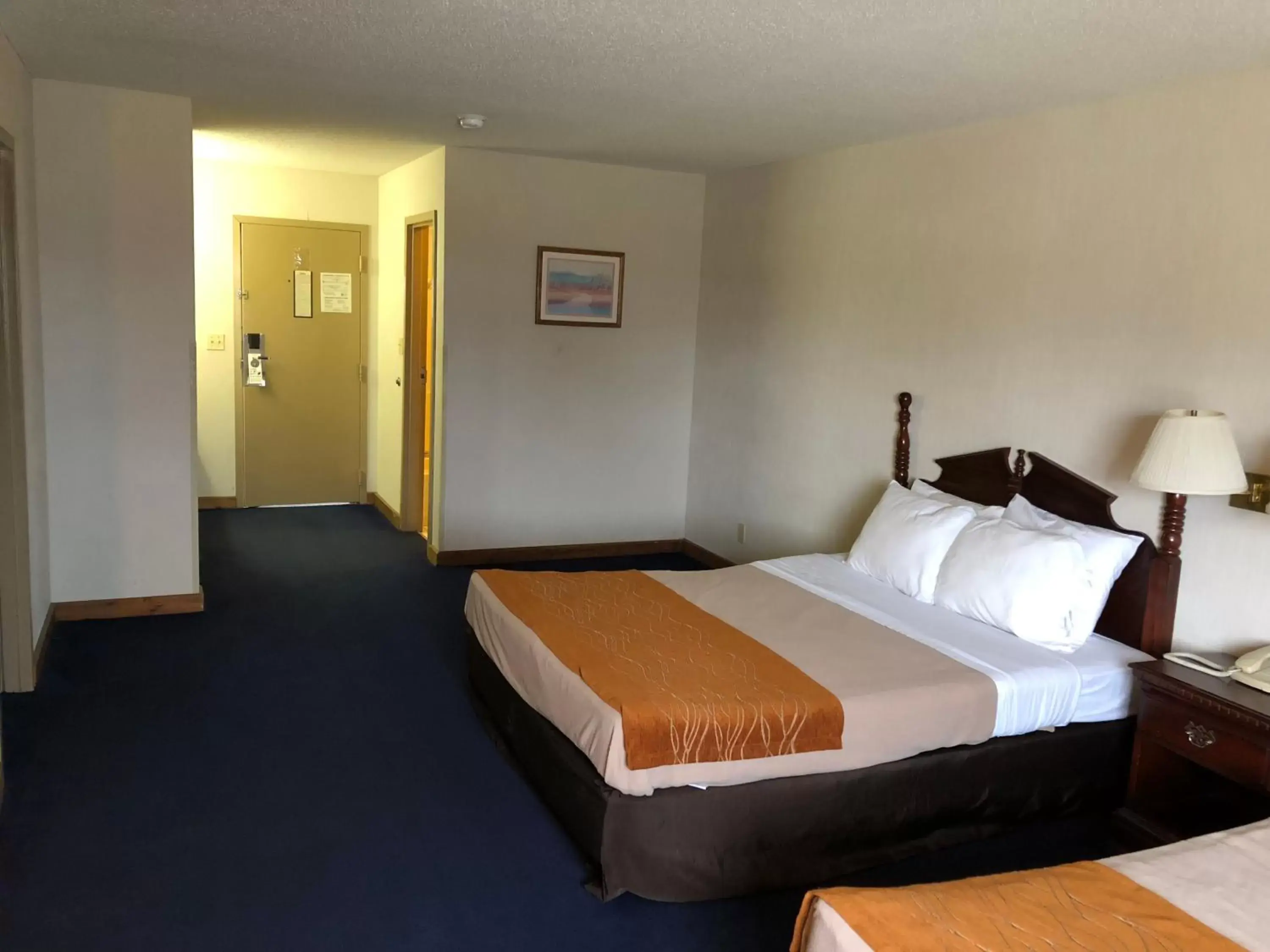Bedroom, Bed in Denison Inn & Suites