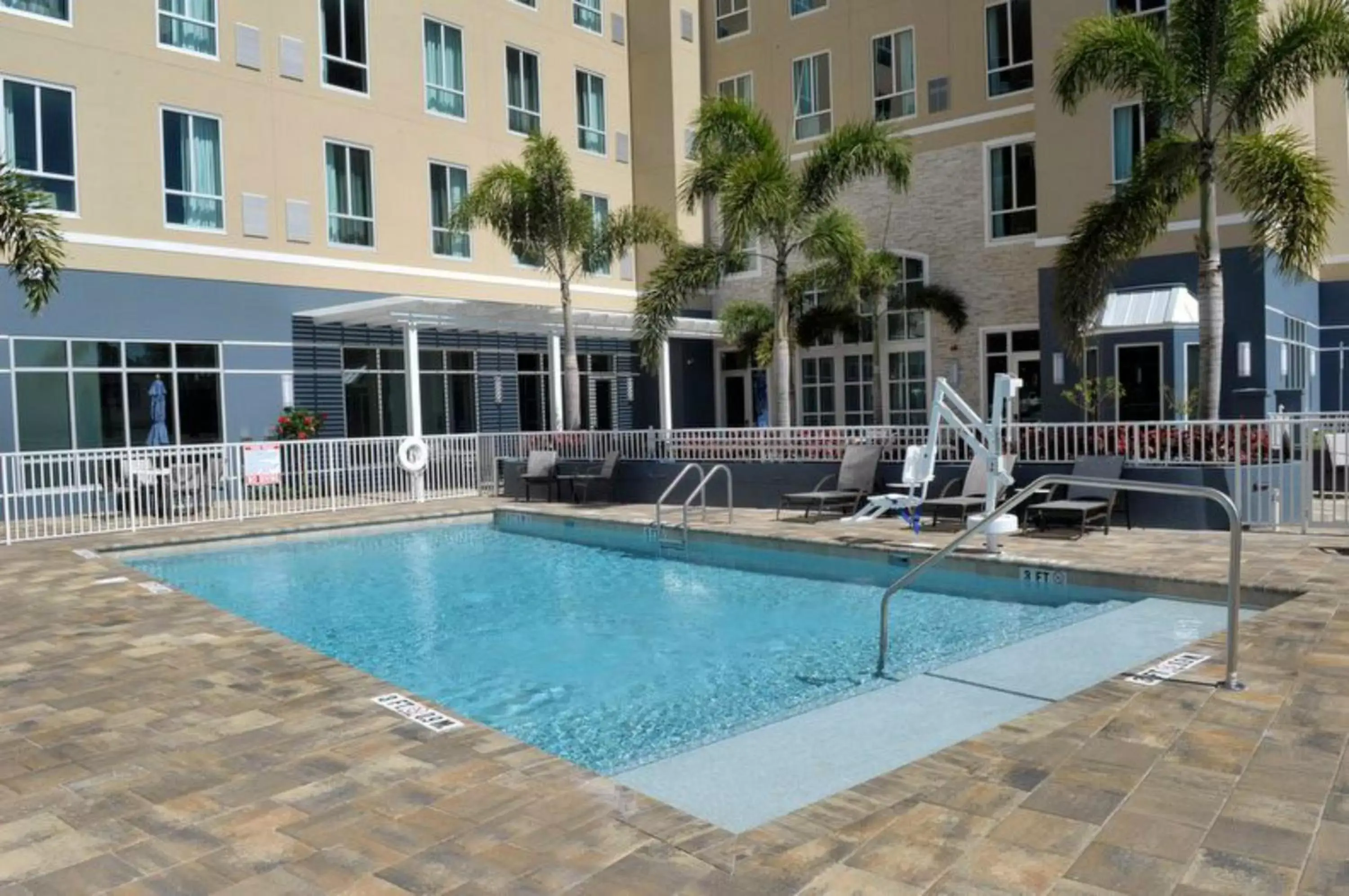 Lobby or reception, Swimming Pool in Staybridge Suites St. Petersburg FL, an IHG Hotel