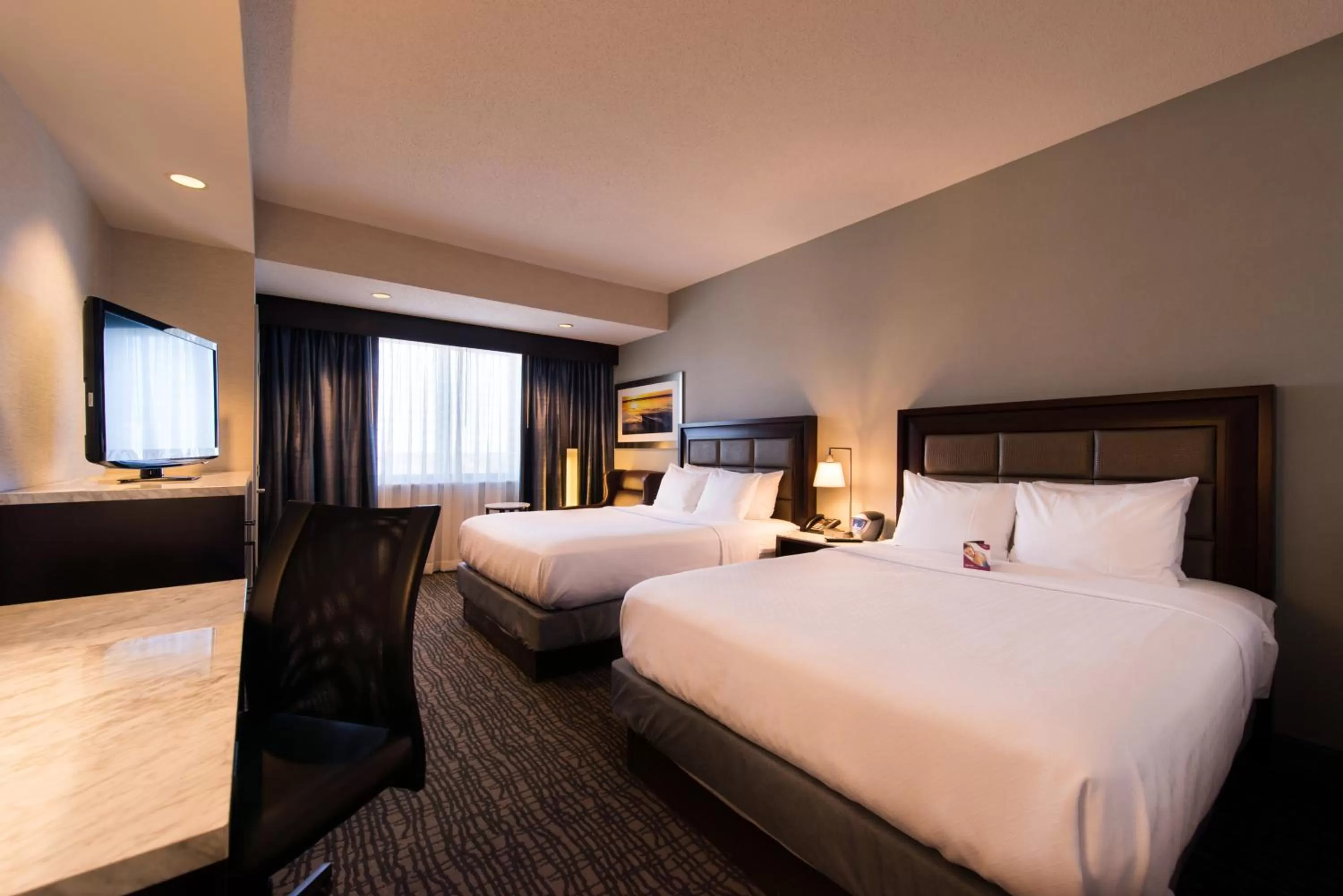 Photo of the whole room, Bed in Crowne Plaza Springfield Convention Center by IHG